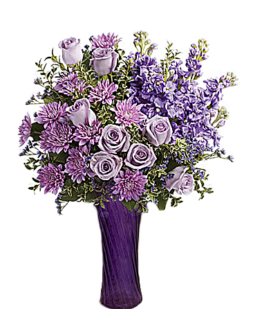 Lavender roses and purple flowers in a tall vase