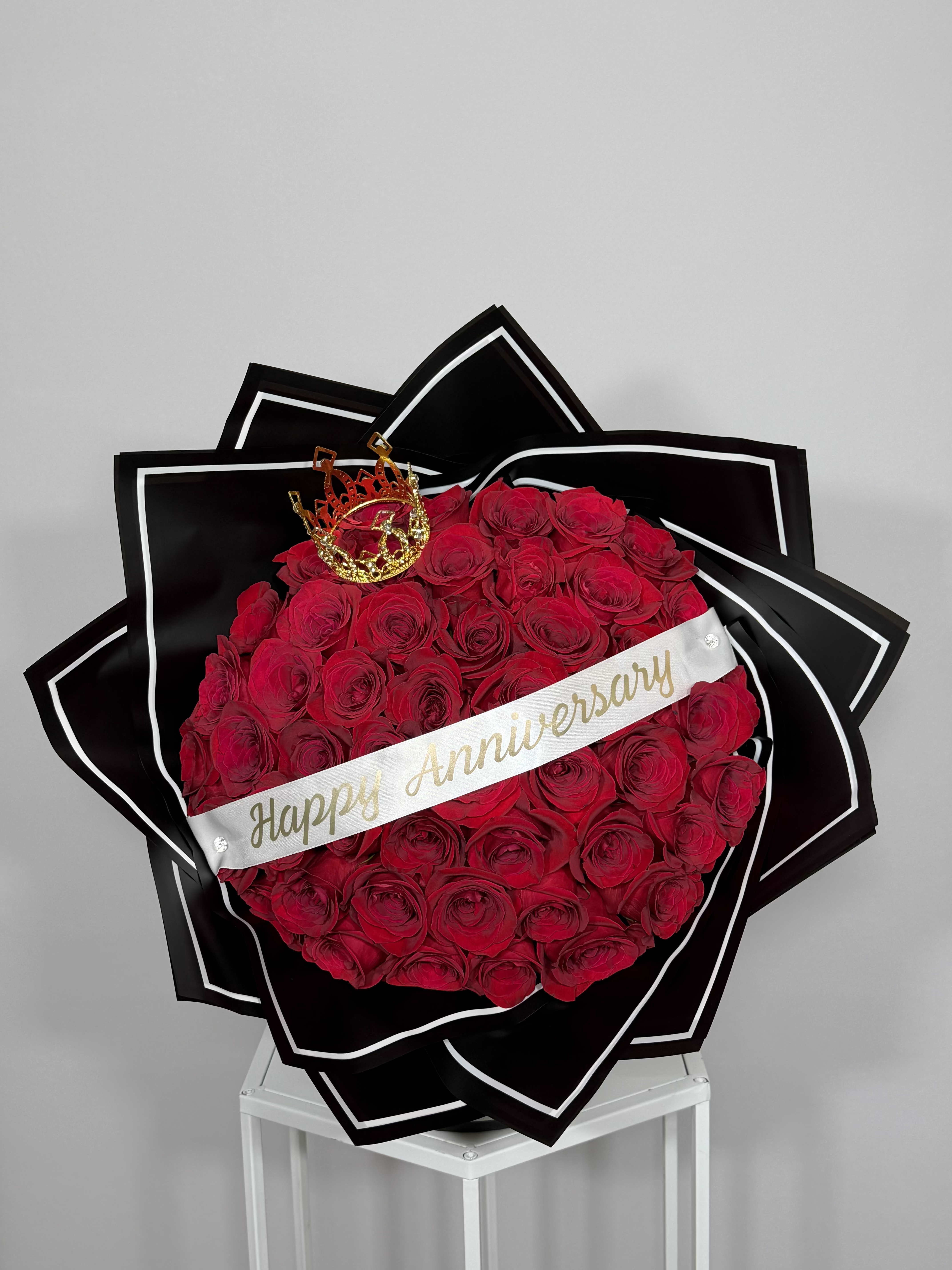 Anniversary Bouquet - Natural Red roses wrapped in black with a white edge. Created to celebrate a love that stands out. Elegant, timeless, and truly unforgettable