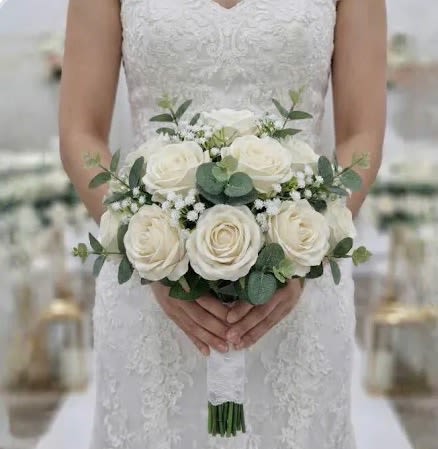 bridal bouquet - An elegant bridal bouquet of white roses and fresh greenery, symbolizing love and new beginnings. Simple, timeless, and beautifully refined.