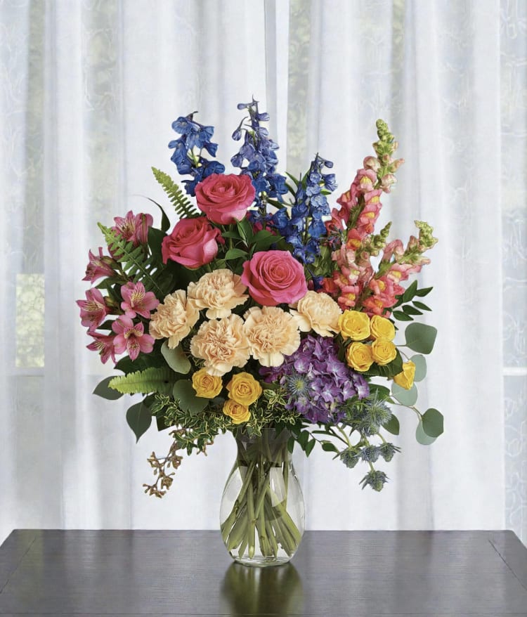 Colorful mixed bouquet in a clear glass vase
