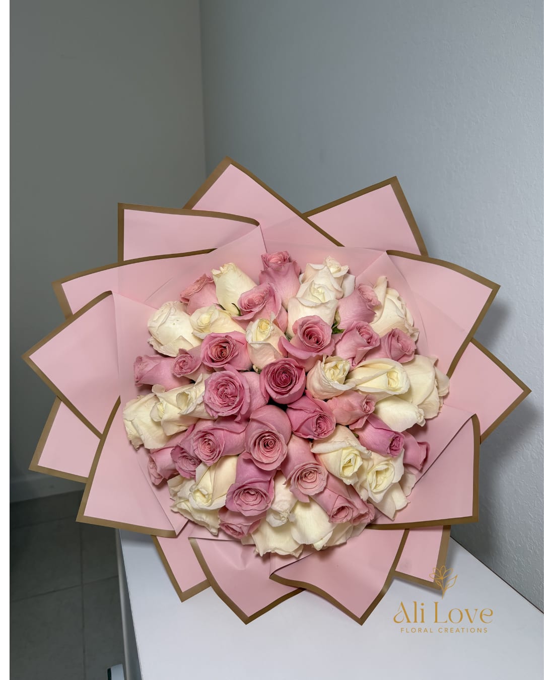 Pink and White Bouquet  - A lovely bouquet of soft pink and white roses, designed to bring a touch of elegance and sweetness to any celebration.