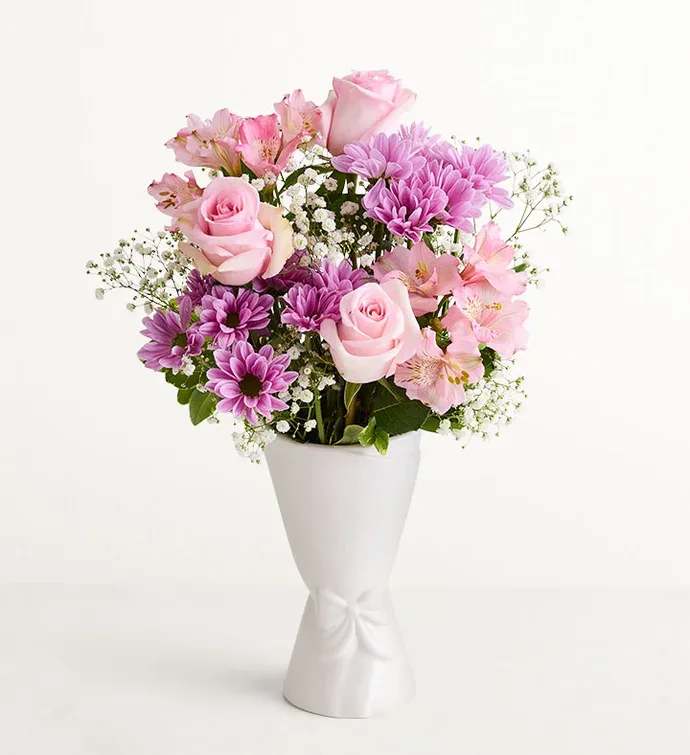 Pastel Garden - Soft pink roses and lavender-purple blooms come together in this pastel garden bouquet to create a gentle, romantic birthday bouquet or thinking-of-you arrangement that feels both cheerful and refined. The color story-soft pinks, pale purples, and bright whites-reads as reassuring and uplifting, the kind of gift that will make the person you're thinking of feel truly seen and cared for.