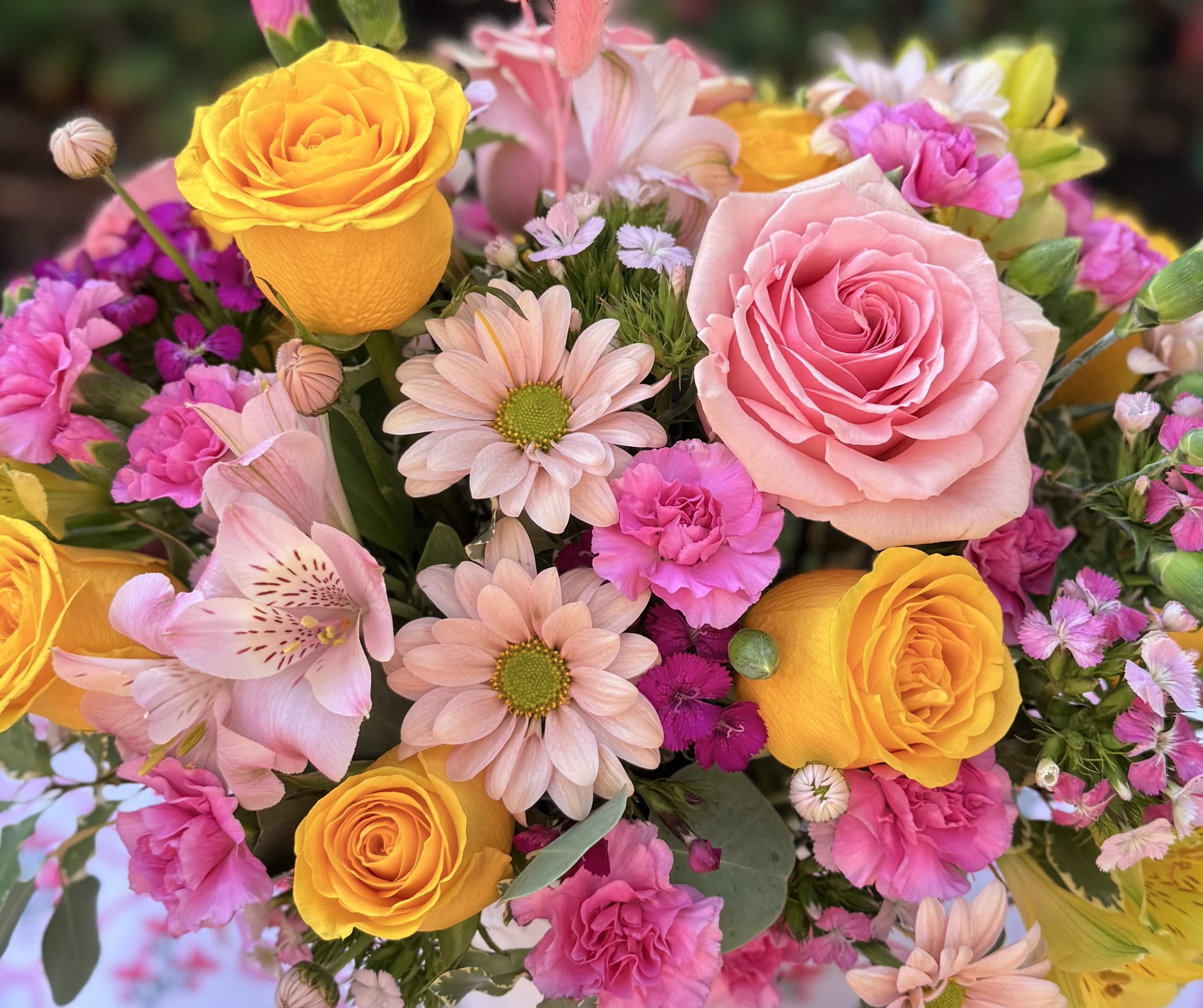  Spring Bouquet “ Designer’s Choice  - Inspired in the happy colors of Spring this beautiful  bouquet is  crafted with premium roses, fancy carnations, daisies, fine alstromerias, seasonal filler flowers and fragrant green foliage Medium size It doesn't include a vase. Some flowers might vary depending on the season and availability. Recipient always receives beautiful blooms.
