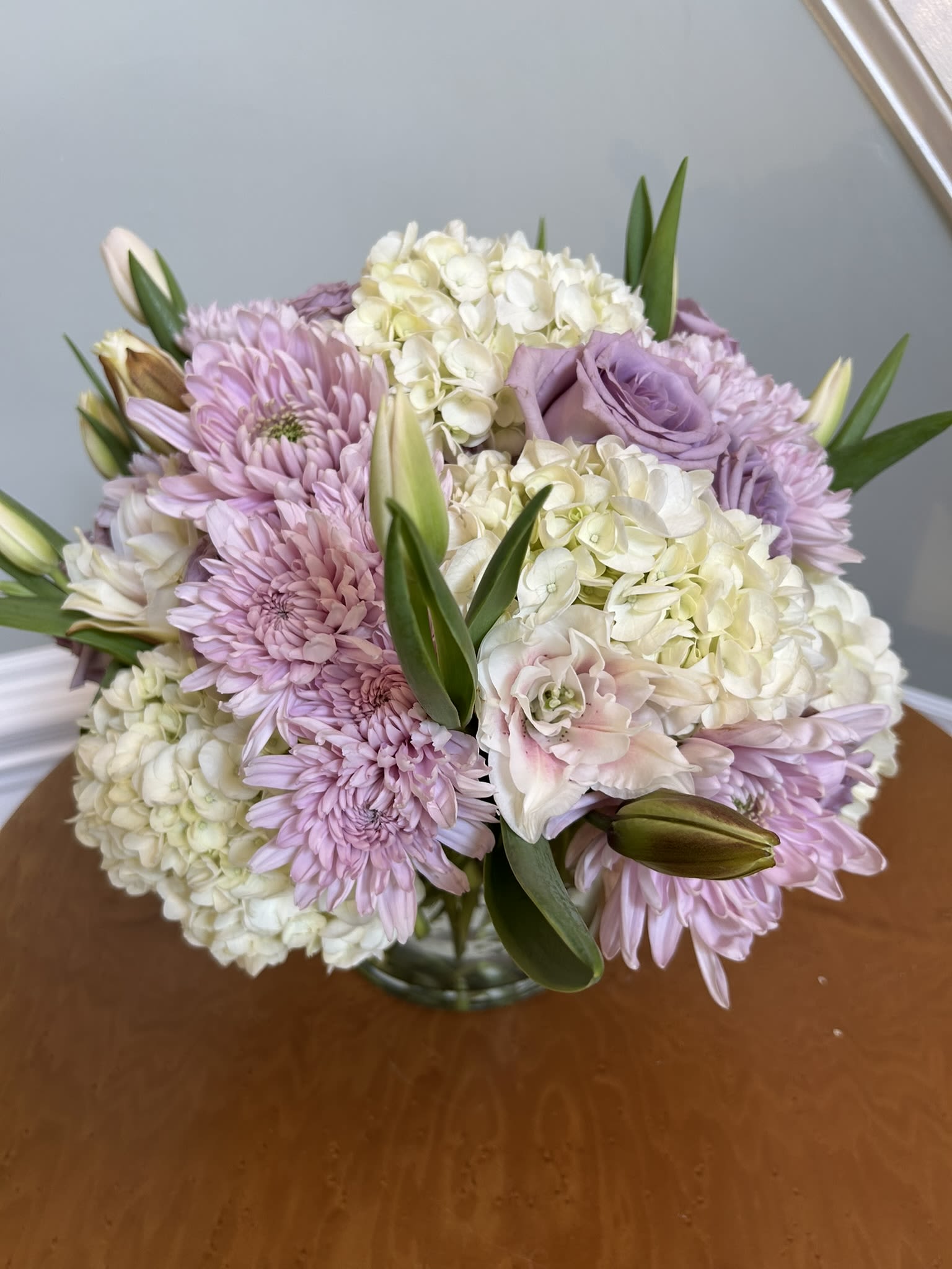 Bouquet of lavender and white flowers in a glass vase