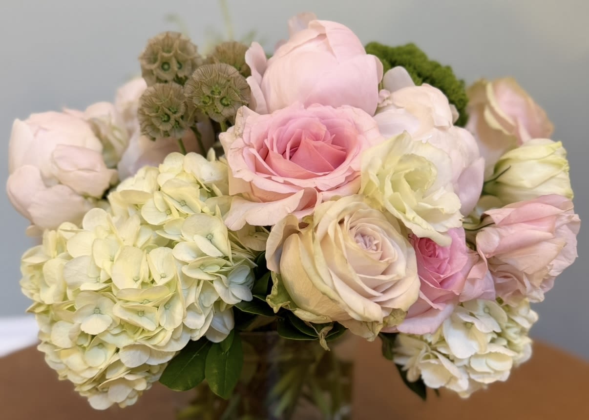 Bouquet of pale pink roses and cream hydrangeas