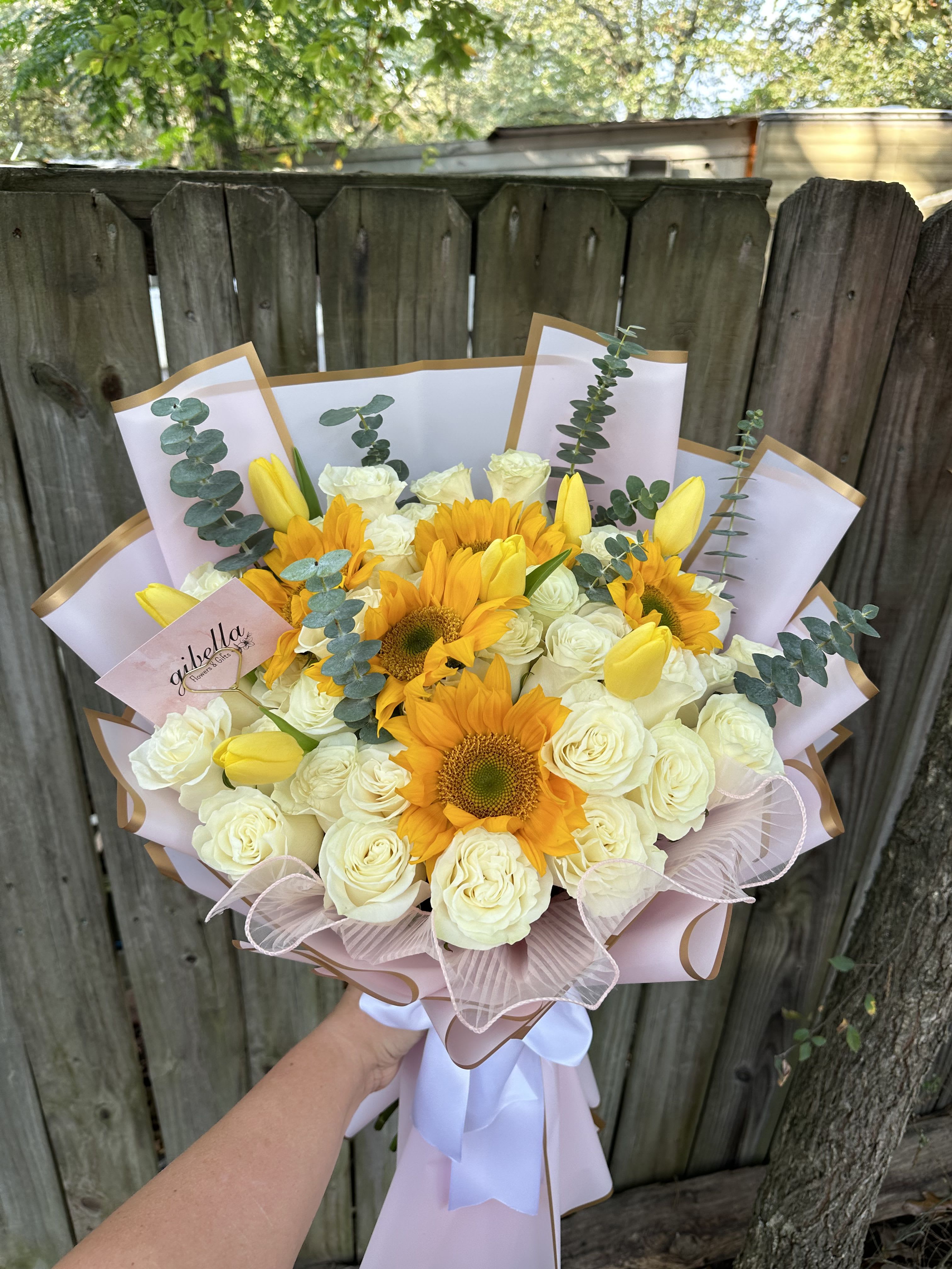 All in one - All in one bouquet, roses sunflowers tulips eucalyptus.  Tulips color will depend on what we have available!