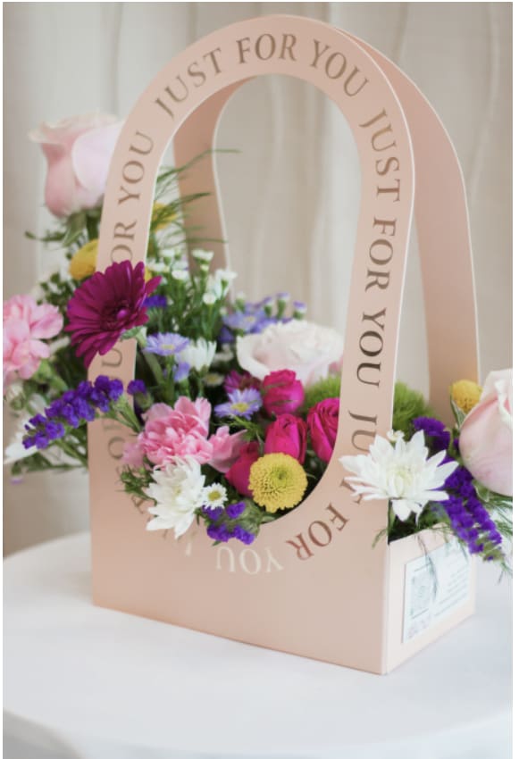 Butterfly Garden - BUNDLE - A whimsical garden brought to life, this enchanting arrangement captures the delicate beauty of butterflies dancing among fresh blooms. Soft, lush florals in harmonious hues create a natural, airy design, accented with subtle butterfly details for a magical touch. Perfect for celebrating love, joy, and life’s sweetest moments.  Includes: 1 pack of (12) Ferrero chocolates  1 Foil Balloon with helium