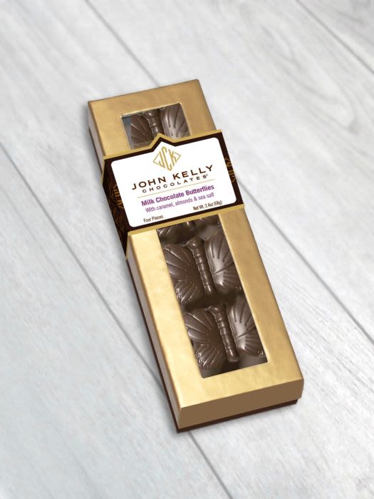 4 Pc John Kelly Milk Chocolate Butterflies - A delightful box of 4 hand-molded butterflies in milk chocolate, with an unbelievable filling of roasted crushed almonds, sea salt and buttery caramel. Certified Dairy Kosher and Gluten Free.