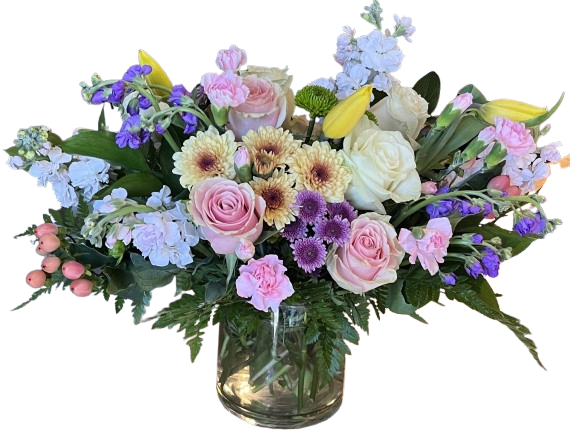 Rosy Whisper Bouquet - Rosy Whisper Bouquet is a soft and elegant floral arrangement designed with timeless beauty and charm. Featuring blush pink roses, creamy white roses, delicate carnations, cheerful daisies, fresh lilies, and seasonal garden blooms, this lush design is arranged in a clear glass vase with rich greenery for a naturally graceful look. With its romantic blend of pastel tones and fresh textures, it is a perfect gift for birthdays, anniversaries, sympathy, thank yous, or simply to brighten someone’s day.