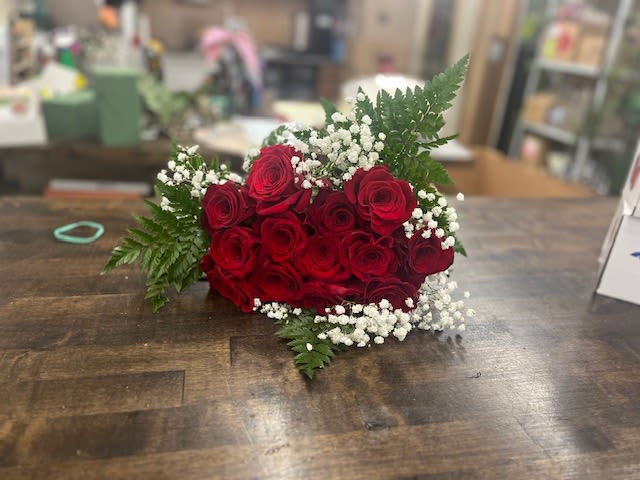 Red rose bouquet with baby's breath and fern greenery