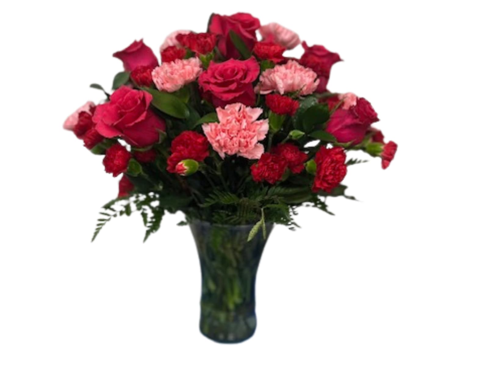 Bouquet of red roses and pink carnations in a dark glass vase
