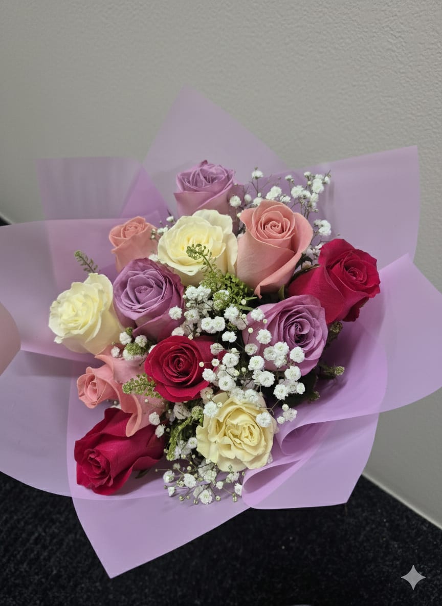 Bouquet of multicolored roses wrapped in lavender paper