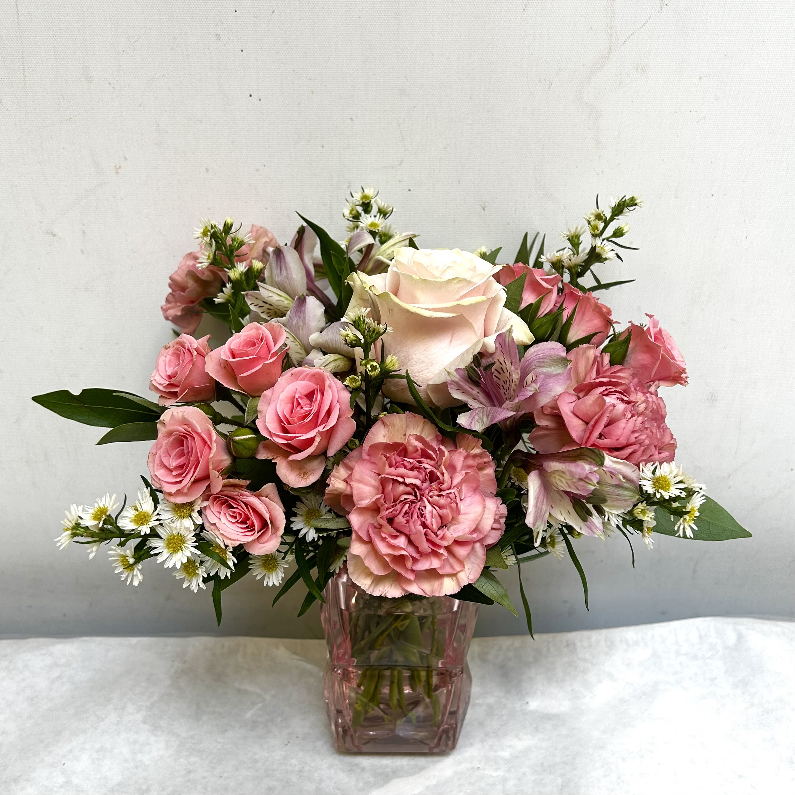 Pink Shimmer - Feminine and dainty all pinks in an irredescent pink vase. The perfect thinking of you bouquet.  
