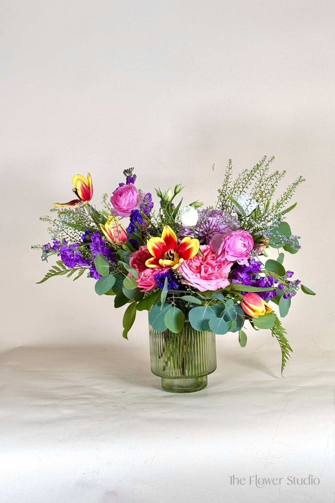 A Petals 4Mom! - A joyful blend of pinks, sunny yellows, and rich purples, this arrangement is full of life and color. Designed in a garden style with lush greenery, it feels fresh, cheerful, and full of love, making it a perfect choice to celebrate Mother’s Day.