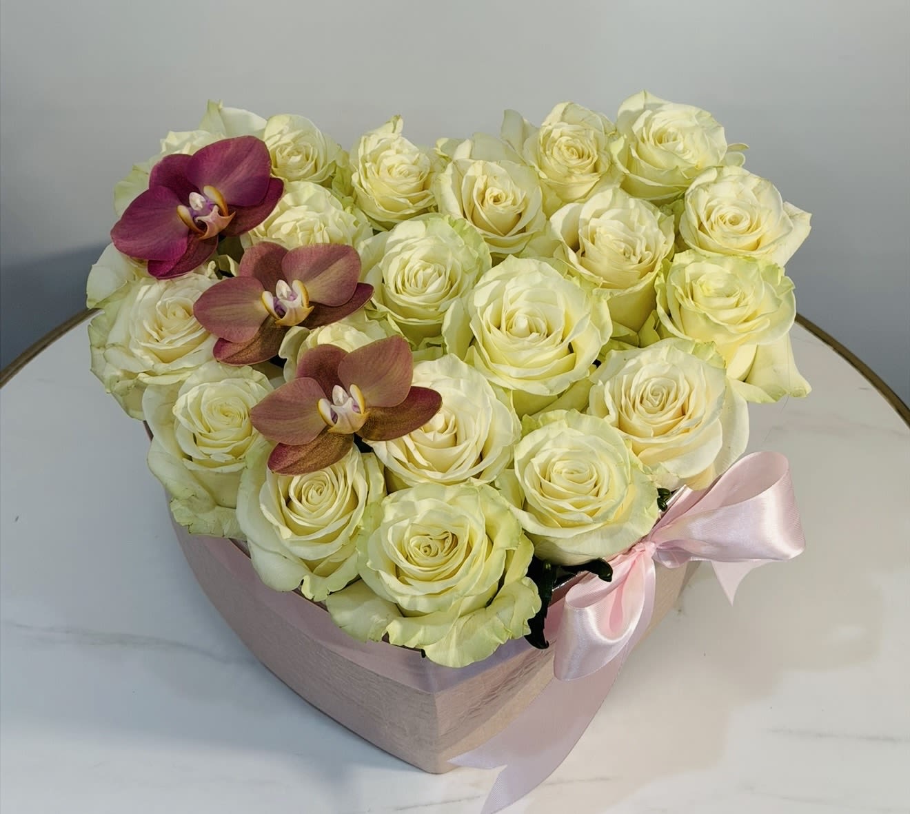 Luxury Orchid Heart Box  - Make a lasting impression with our luxurious Orchid Heart Box by Guy Floral Studio. This exquisite heart shaped arrangement features premium orchids carefully arranged in an elegant box, symbolizing love, beauty, and sophistication. Perfect for romantic occasions, anniversaries, birthdays, or special surprises, this unique floral design blends modern luxury with timeless elegance. Each arrangement is handcrafted with attention to detail, ensuring a fresh and breathtaking presentation. Guy Floral Studio proudly offers same day flower delivery across Beverly Hills, Bel-Air, West Hollywood, Hollywood Hills, Beverly Grove, Culver City, and Santa Monica. Whether you’re sending love or celebrating a special moment, this orchid heart box is designed to impress and elevate every occasion. Order today and experience luxury flower delivery at its finest with Guy Floral Studio.