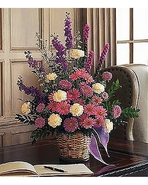 White &amp; Lavender Basket - This lovely lavender arrangement, with its asters, chrysanthemums and larkspur, will remind us all that there?s hope. One arrangement with lavender asters, chrysanthemums and larkspur, and white carnations and spray asters is delivered in a natural wicker basket. 
