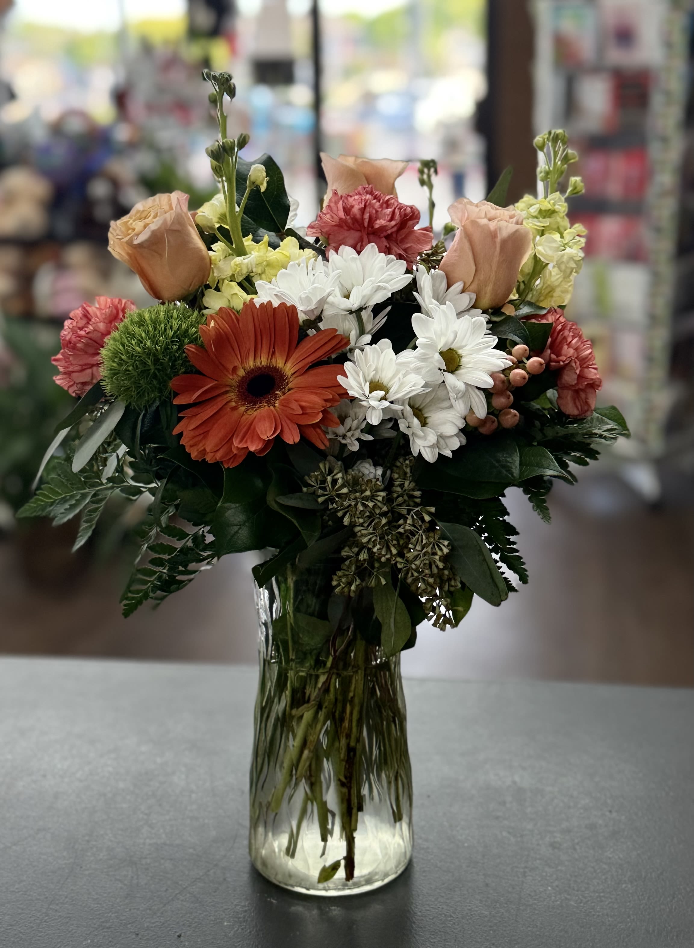 Petal Party - Mixed bouquet of roses, gerbera, carnations, stock and coffee berries in peach, yellow and orange hues