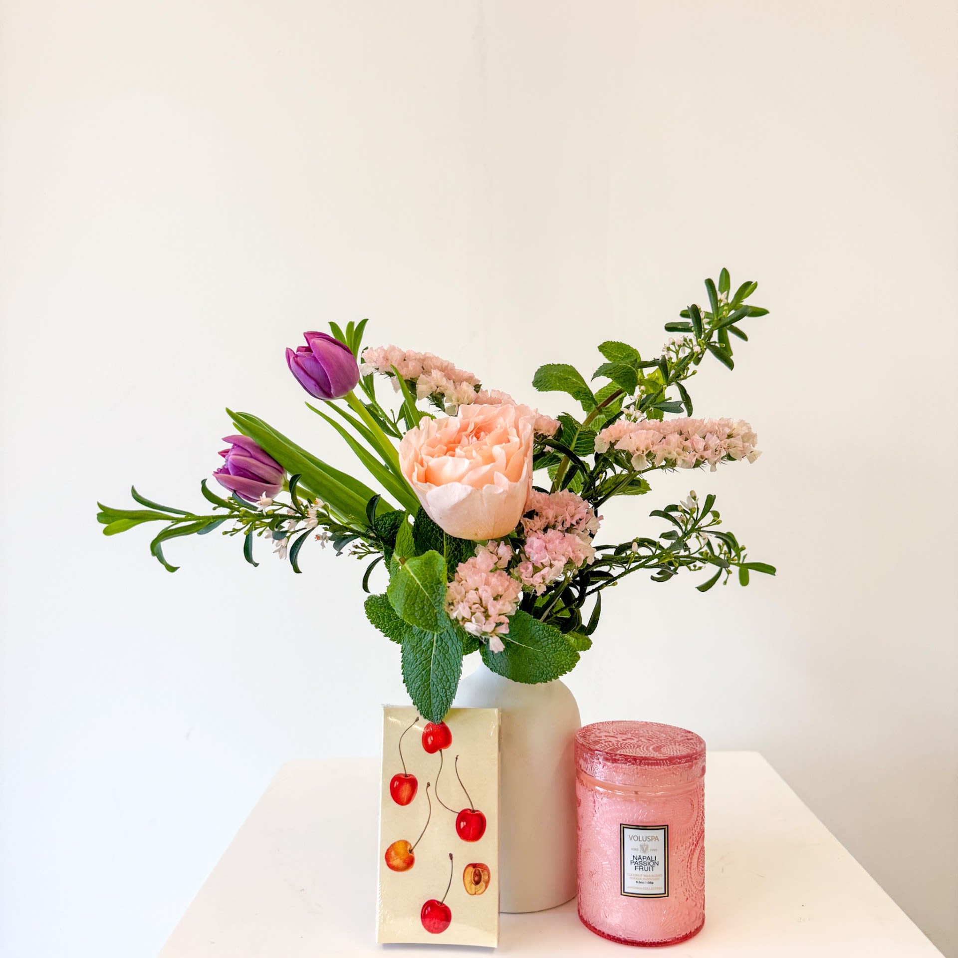 Blossom &amp; Glow Gift Set - This gift set includes a luxurious petite vessel filled with premium blooms, a small Voluspa Candle and a set of matches.  Upgrade to Deluxe or Premium for larger arrangements