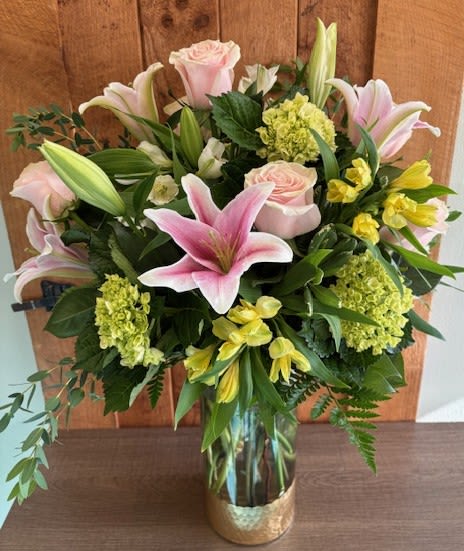 Mom's Garden - Pink lilies and roses surrounded by lush greens, hydrangea and assorted alstroemeria. A garden any mother would love!