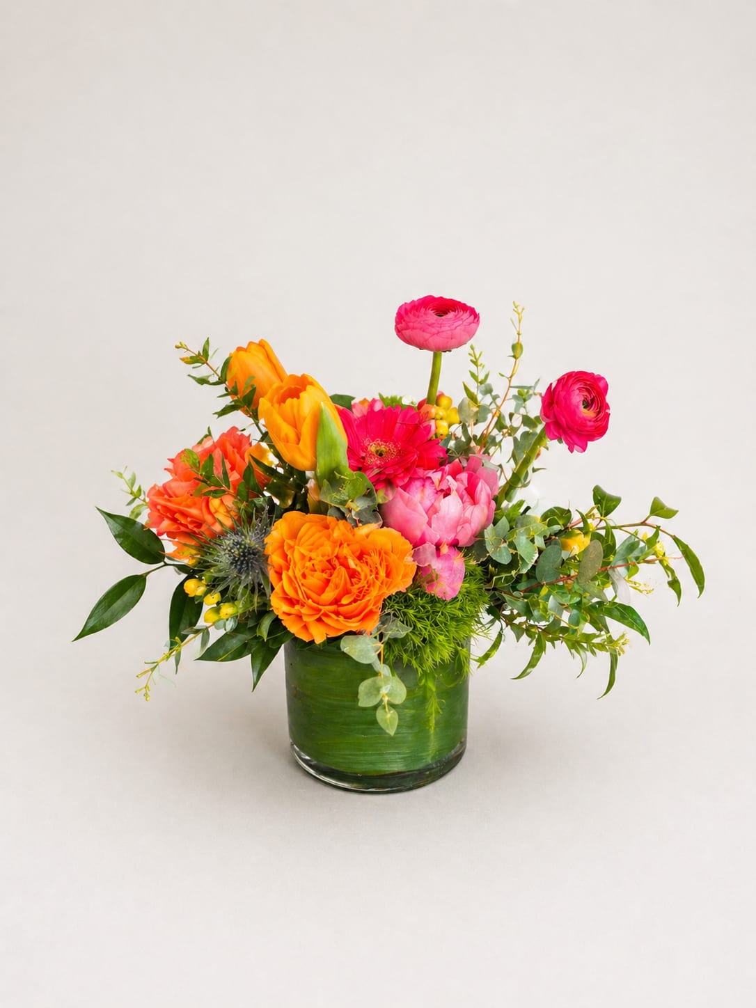 The Bright Side  - A burst of sunlit color-The Bright Side is a mixed flower arrangement designed to make someone feel genuinely seen. Perfect as a birthday bouquet, anniversary gift, Mother's Day surprise, or a cheerful "just because" pick-me-up, this lively arrangement balances warm oranges, and pinks for a confident, joyful statement the recipient will remember.