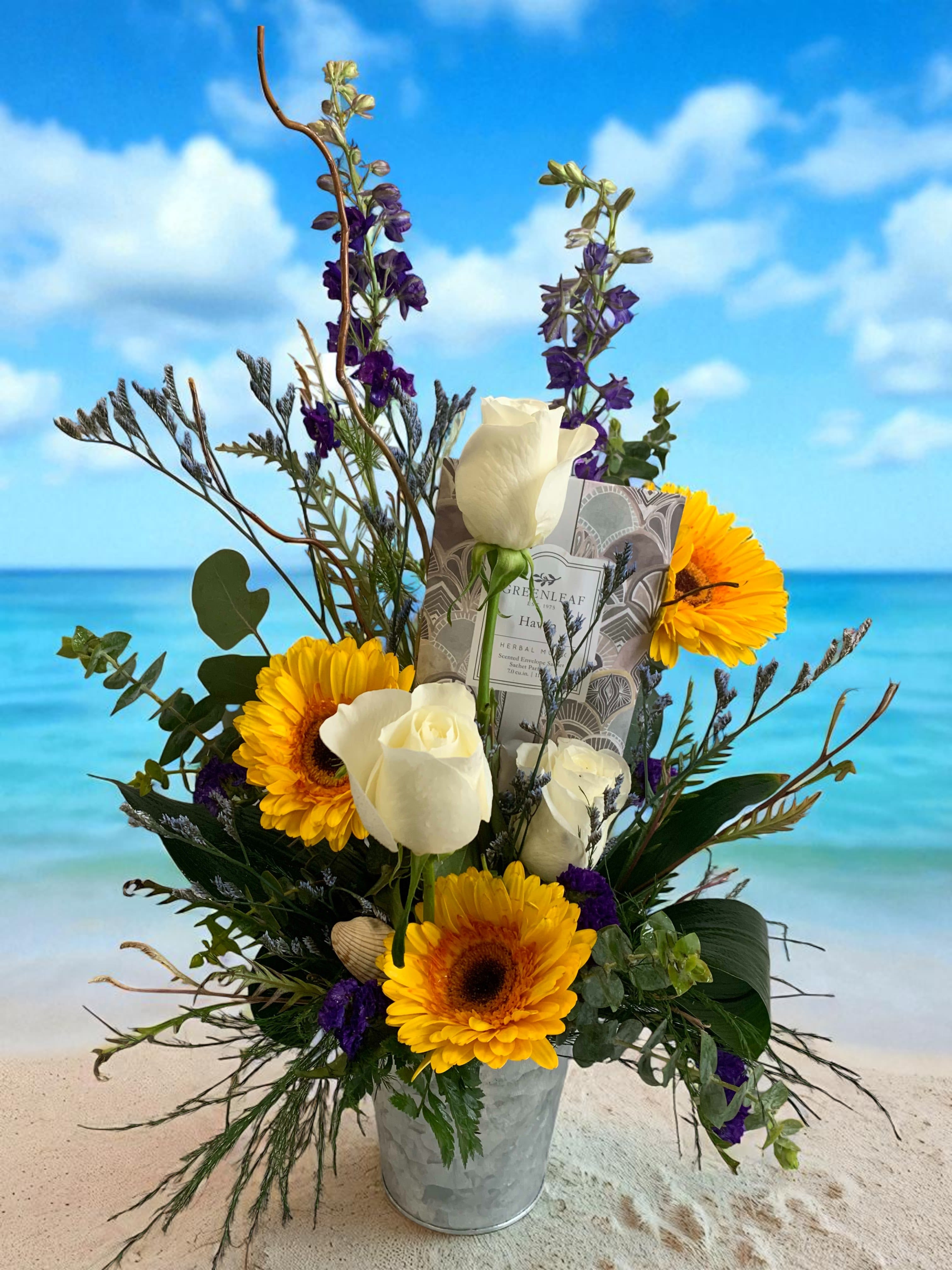 Ocean Bliss - A serene retreat of blooms in beachy hues. Blues like the ocean, yellows of the sun, and white like the sand of your favorite beach. 