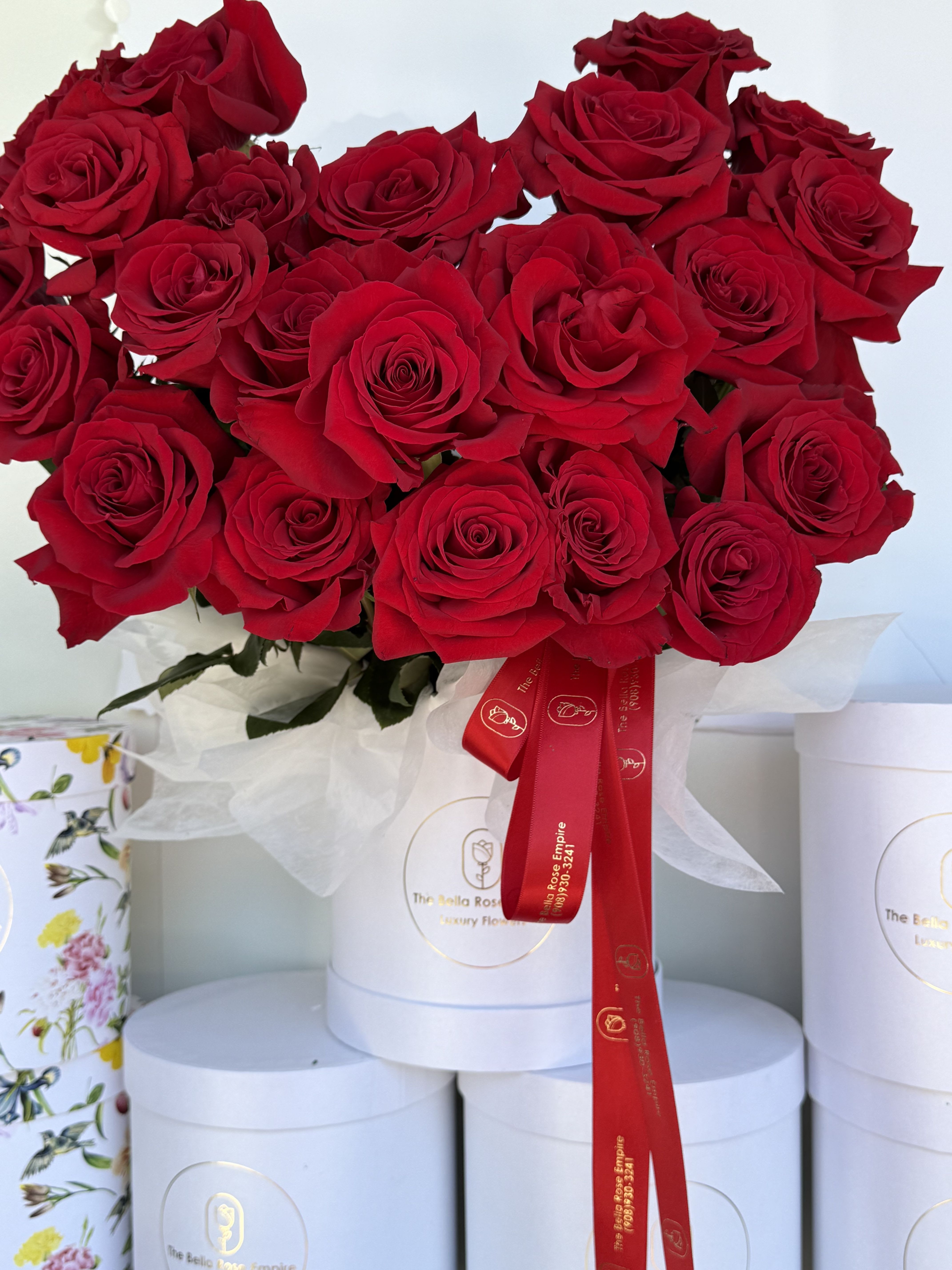 Royal Box  - Beautiful bouquet of seasonal sunflowers in buchon style long stems wrapped with floral paper includes a card with message and a bow with optional message