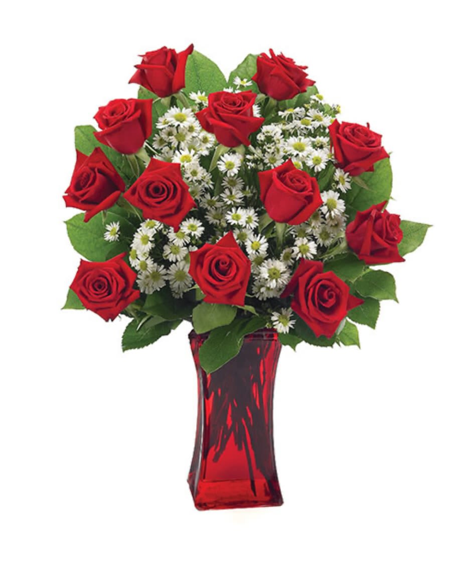 Red roses and white daisy-like flowers in a red glass vase