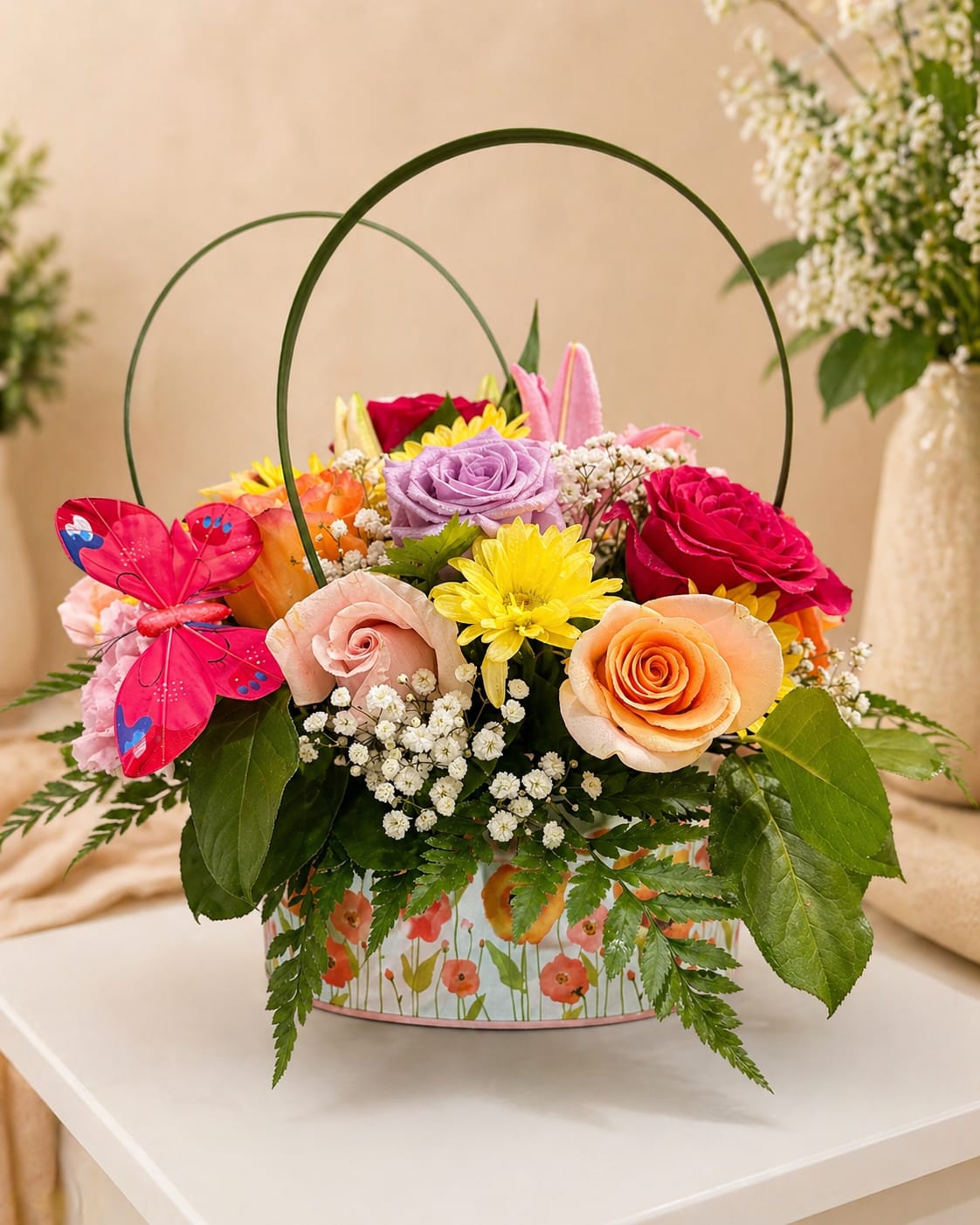 Spring Color Basket - A fresh and vibrant floral arrangement designed to capture the beauty of spring in every detail   This charming design features a colorful mix of roses, daisies, and seasonal flowers, accented with soft greenery and a decorative butterfly for a joyful and elegant finish.