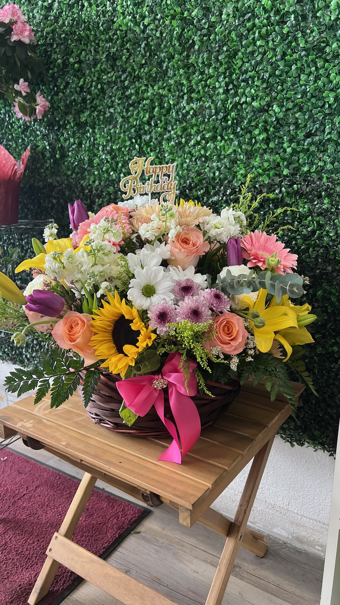 Garden Glow Basket - A beautifully balanced arrangement of bright cheerful flowers designed to bring joy and natural charm to any space