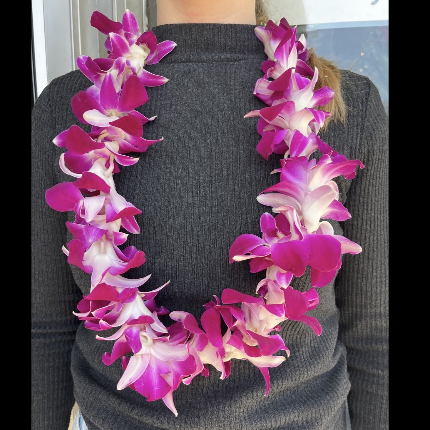 Graduation Lei (PICKUP ONLY) - Orchid flowers strung together to create a celebratory graduation lei. This item is available to order online for pickup only May 14-17th (although alternative dates may be available with enough notice, please call us to see if we have availability). The lei should be stored in a cool place or in the refrigerator until it is used.