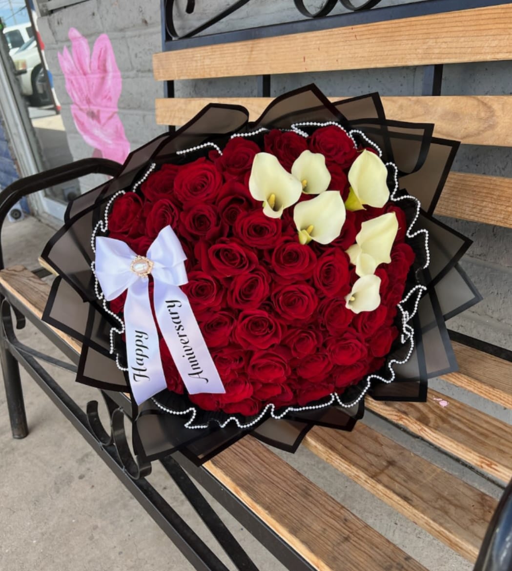 Forever Love Bouquet  - A grand bouquet of 55 long stem roses complemented by 6 calla lilies, symbolizing, deep love, and timeless, beauty