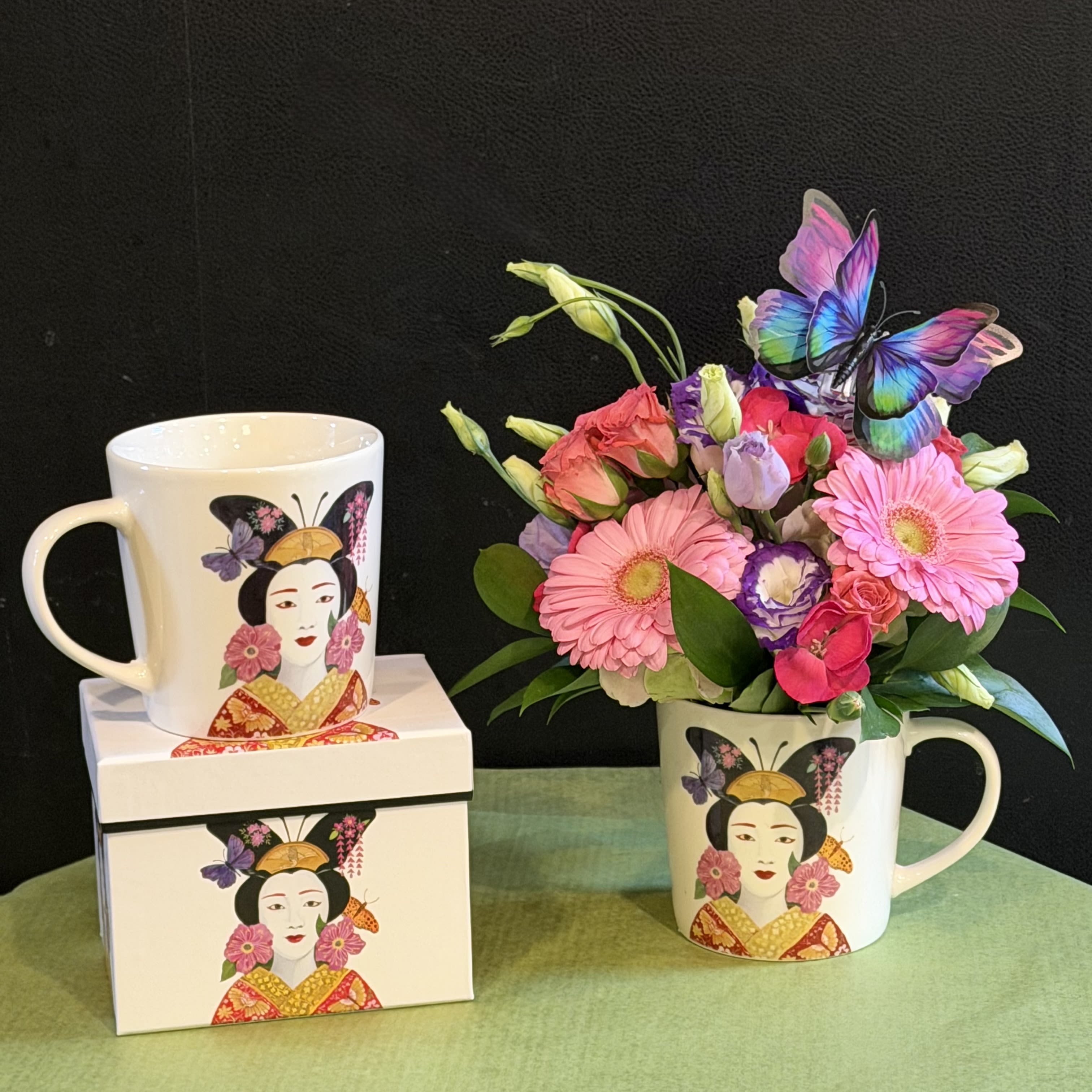 Madame Butterfly - Elegant and vibrant arrangement in a beautifully illustrated mug, featuring pinks and purples with a decorative butterfly accent. Mug is microwave and dishwasher safe—artful and functional.  