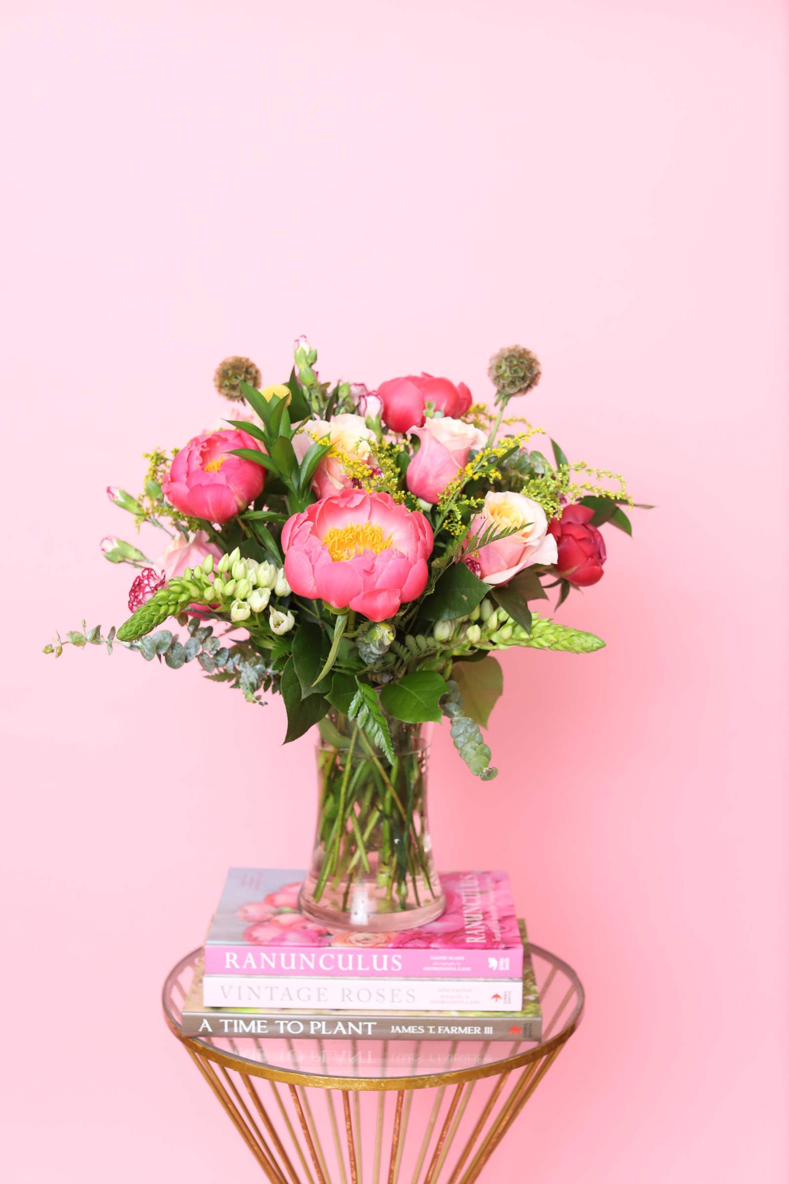 "Pink Peonies" - Introducing "Pink Peonies" – an enchanting floral arrangement that captures the essence of springtime romance. With 10-12 stems of delicate pink peonies, complemented by hydrangeas, pink roses, and lush assorted greenery, this arrangement exudes elegance and charm. Whether as a gift to express love or to add a touch of beauty to your space, "Pink Peonies" is sure to delight and captivate with its exquisite blend of colors and textures.