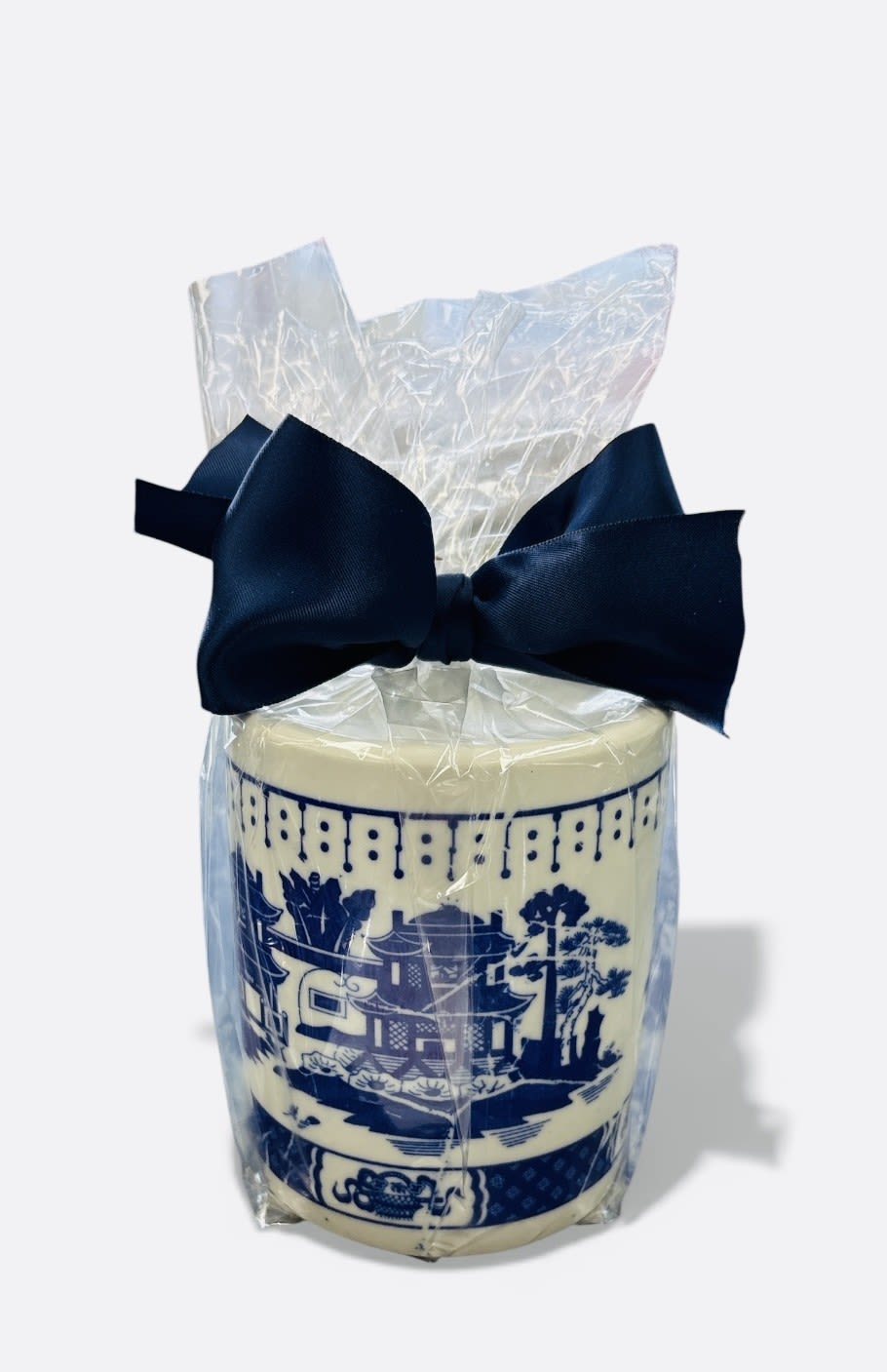Wrapped decorative candle with a navy bow