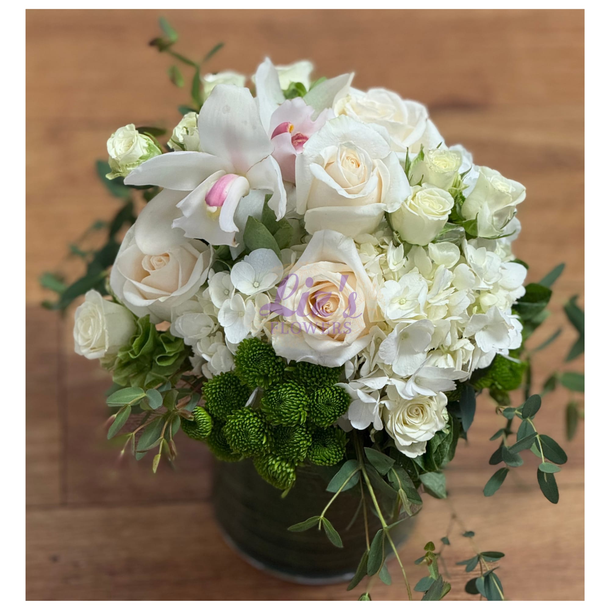 Moonlight Orchid - Premium white Roses, spray roses, and pillowy Hydrangeas, accented with blush Phalaenopsis Orchids