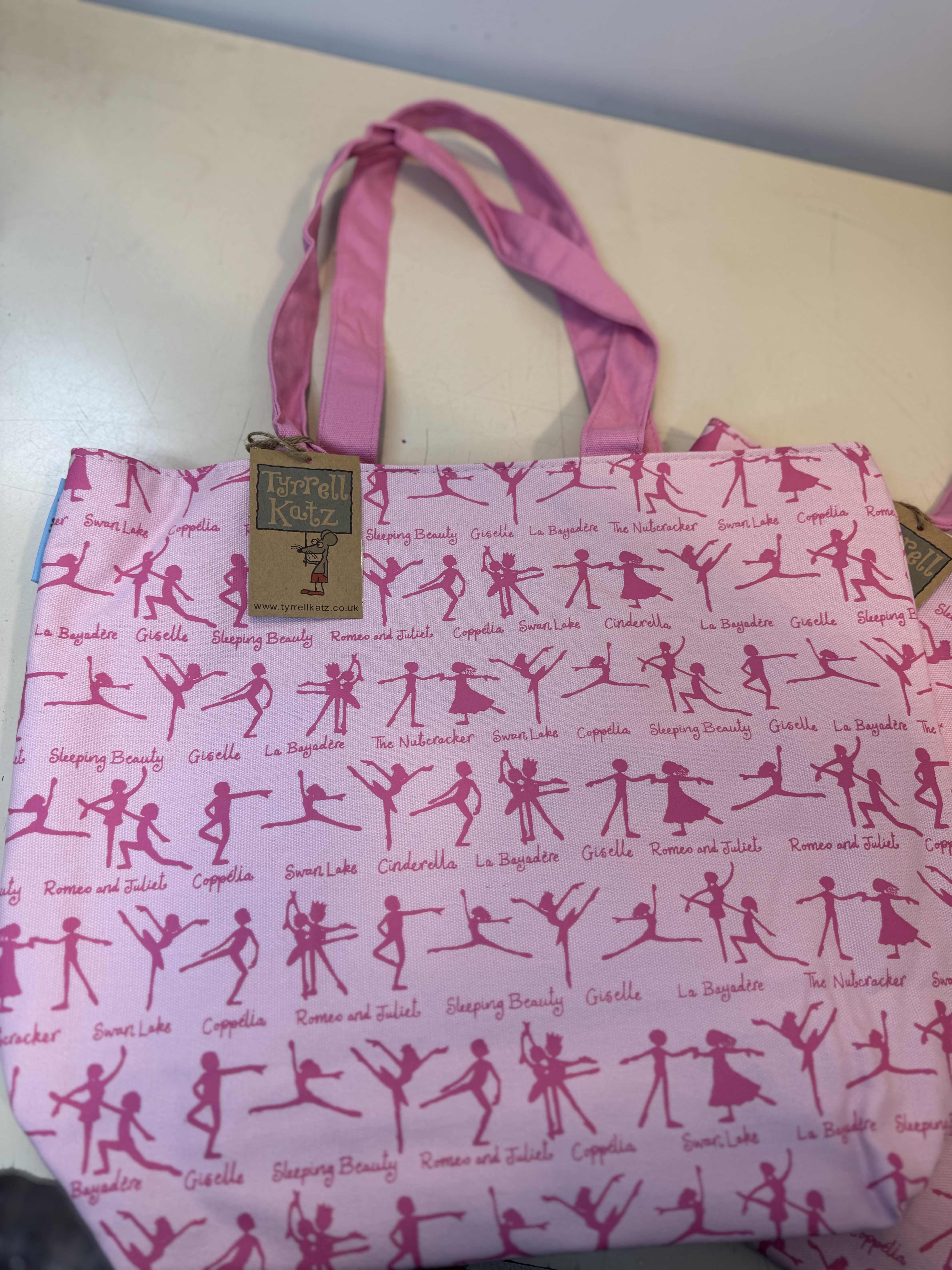 Dance Tote Bags - Charming pink ballet tote featuring classic ballet silhouettes and iconic dance productions. Perfect for recital gifts, dance class essentials, and everyday use. 