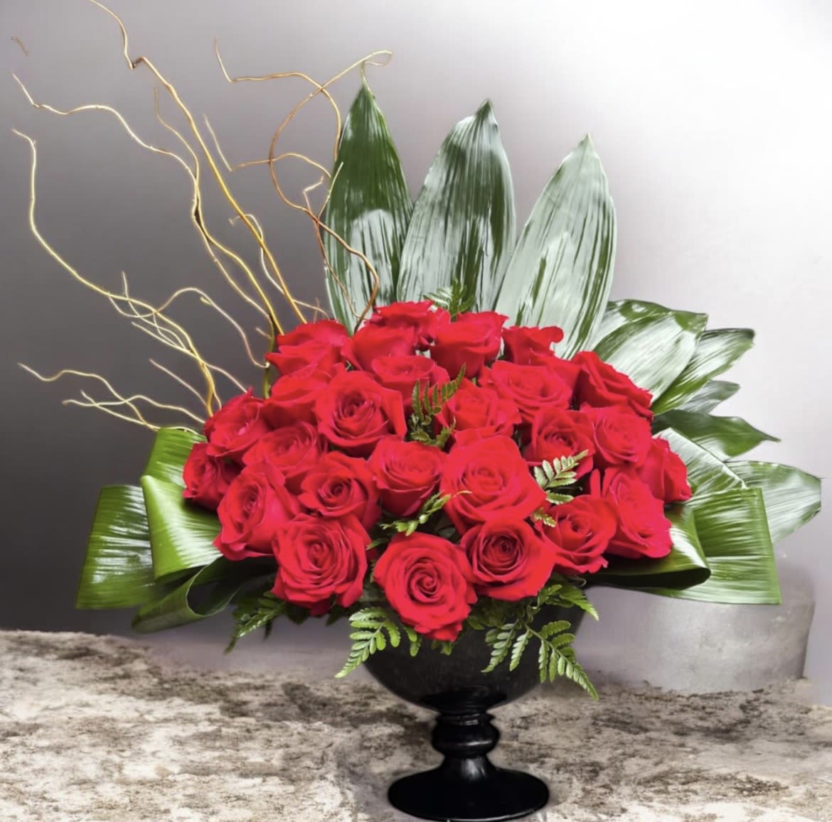 Heartfelt  - This Beautiful arrangement has Red Roses, curly willow, Leather leaf and green tie leaves. This arrangement is a wonderful way of showing someone how much you love them. 