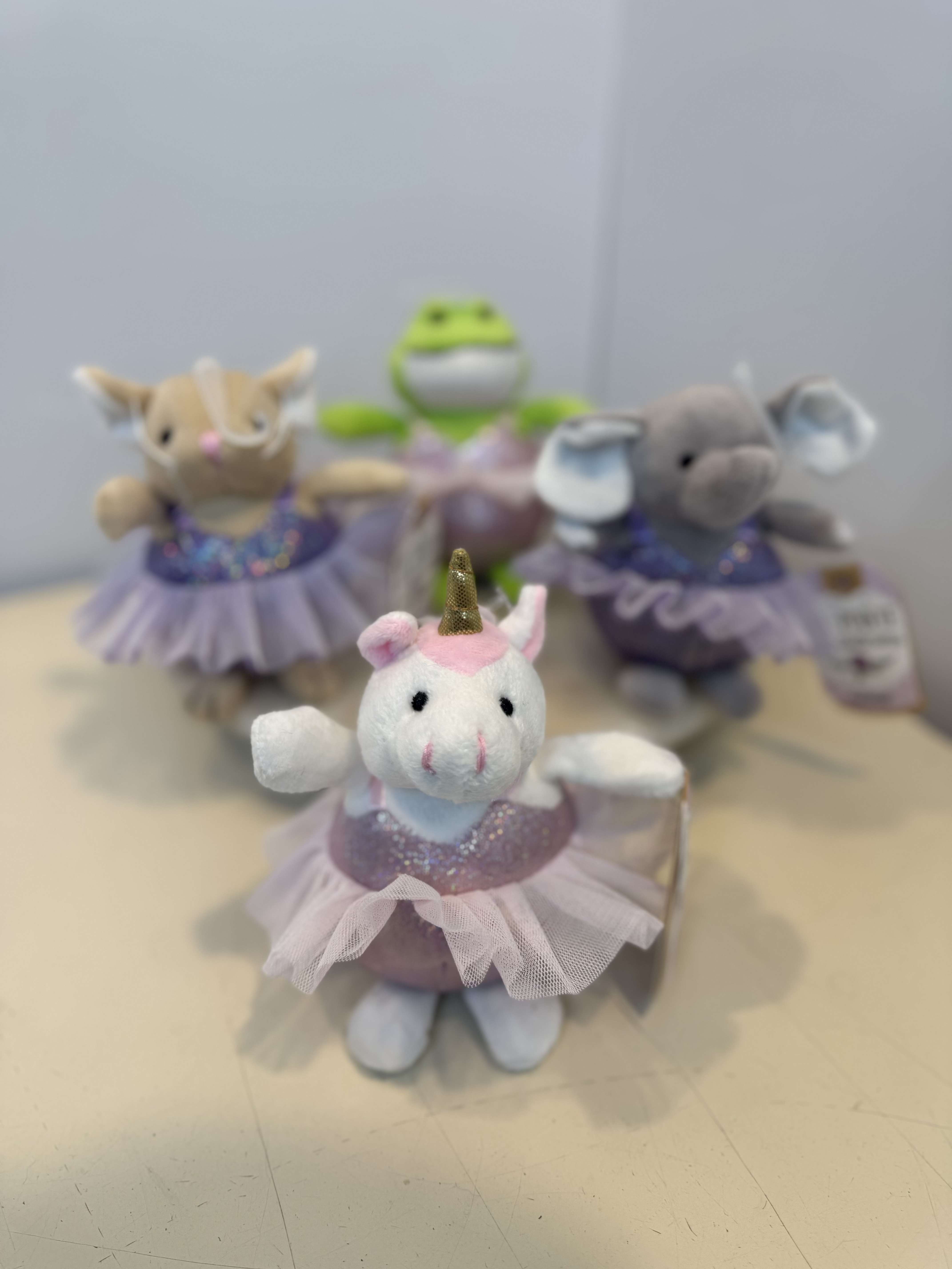 Mini Plush Ballerina Animals - Mini plush ballerina animals dressed in glittery tutus. Featuring adorable characters like a unicorn, elephant, frog, and mouse- perfect for dance recital gifts and sweet surprises. 