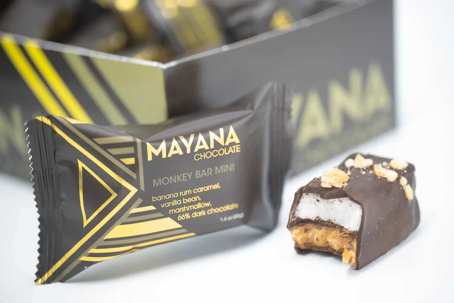 Mayana Monkey Bar - Description:  We've finally gone bananas, but only a little bit! You'll love this playful candy bar, containing banana rum marshmallow and salted caramel, all coated perfectly with dark chocolate.   Contains: Milk, soy.  May contain: Traces of eggs, wheat, tree nuts, and peanuts.