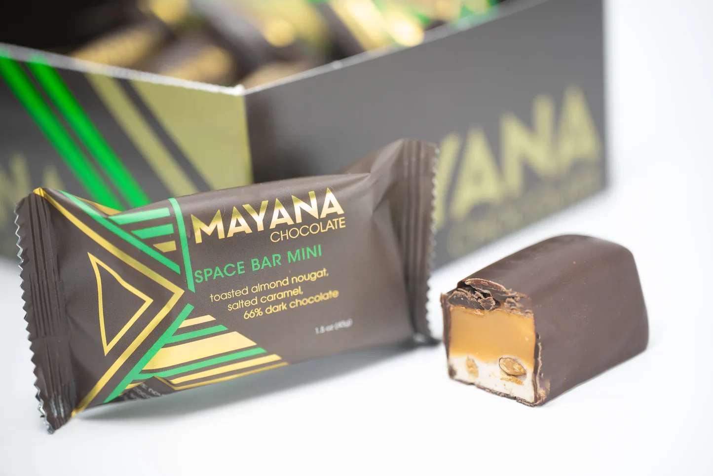 Mayana Space Bar - Description:  Savor the moment with this award winning candy bar, with it's rich vanilla nougat, toasted almonds, salted caramel, and our custom-blend dark chocolate.   Contains: Almonds, milk, soy, and eggs.   May contain: Traces of tree nuts, peanuts, and wheat.