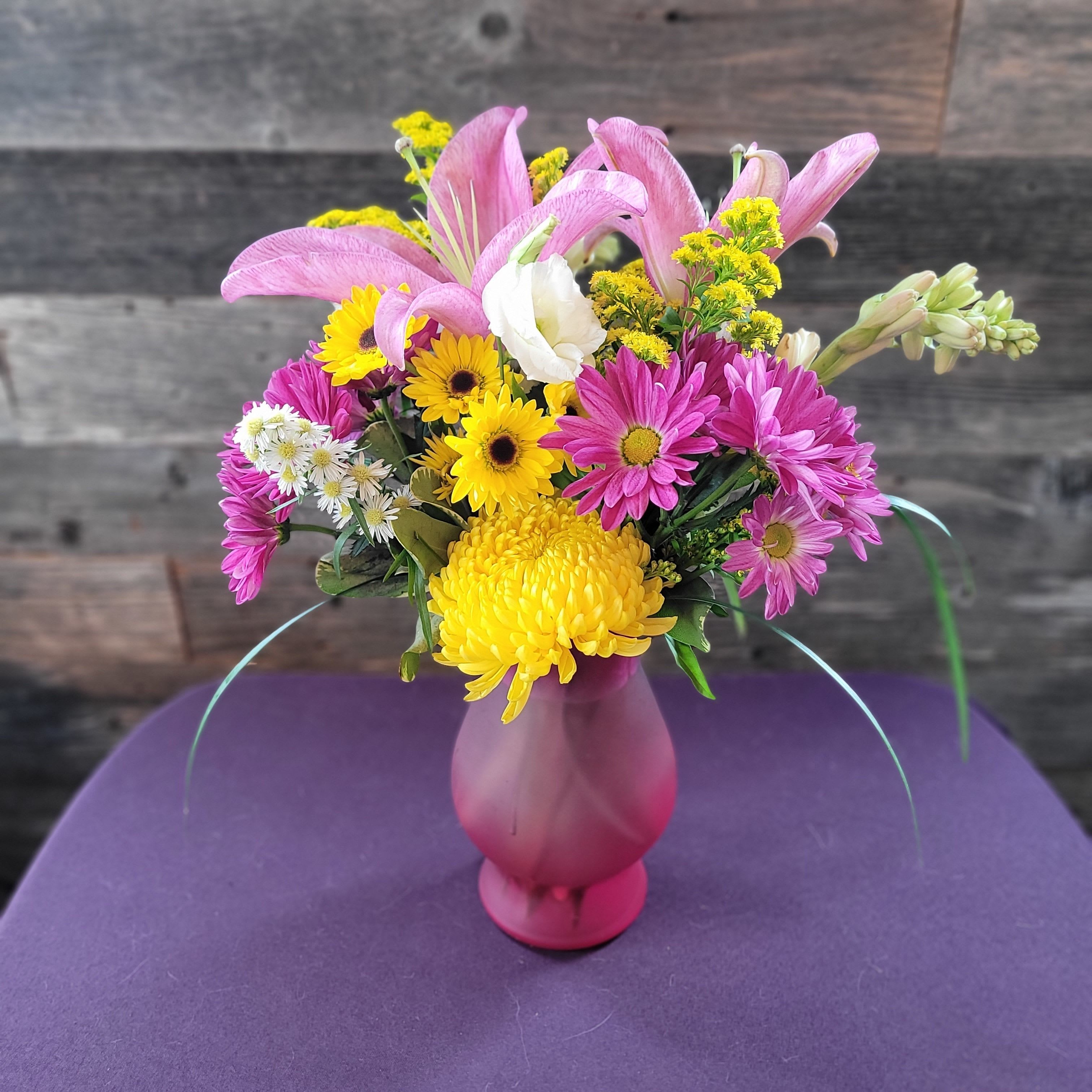  Bight and Cheerful  - Bright pinks and sunny yellows in a playful vase—bold, cheerful, and full of life.