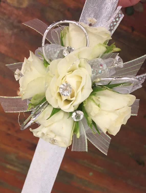White rose wrist corsage with silver ribbon and clear accents