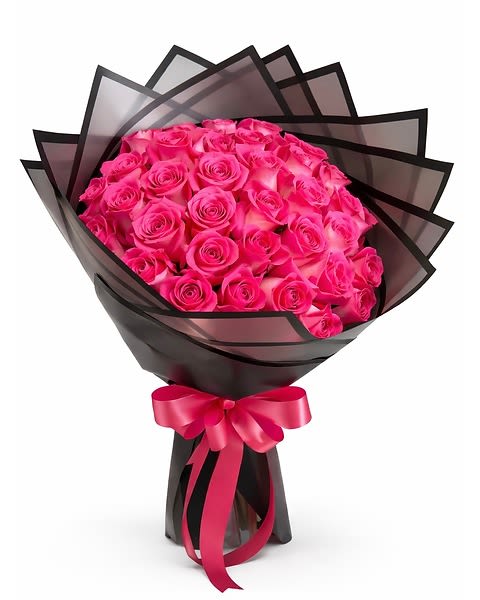 Hot  Pink Roses    wrapped Bouquet  -    A charming and elegant bouquet featuring 24 beautiful  Hot pink roses gracefully accented with fresh green fillers and wrapped in stylish  wrapping paper. This lovely arrangement radiates warmth, admiration, and gentle affection — making it a perfect gift for birthdays, celebrations, or simply brightening someone’s day. 