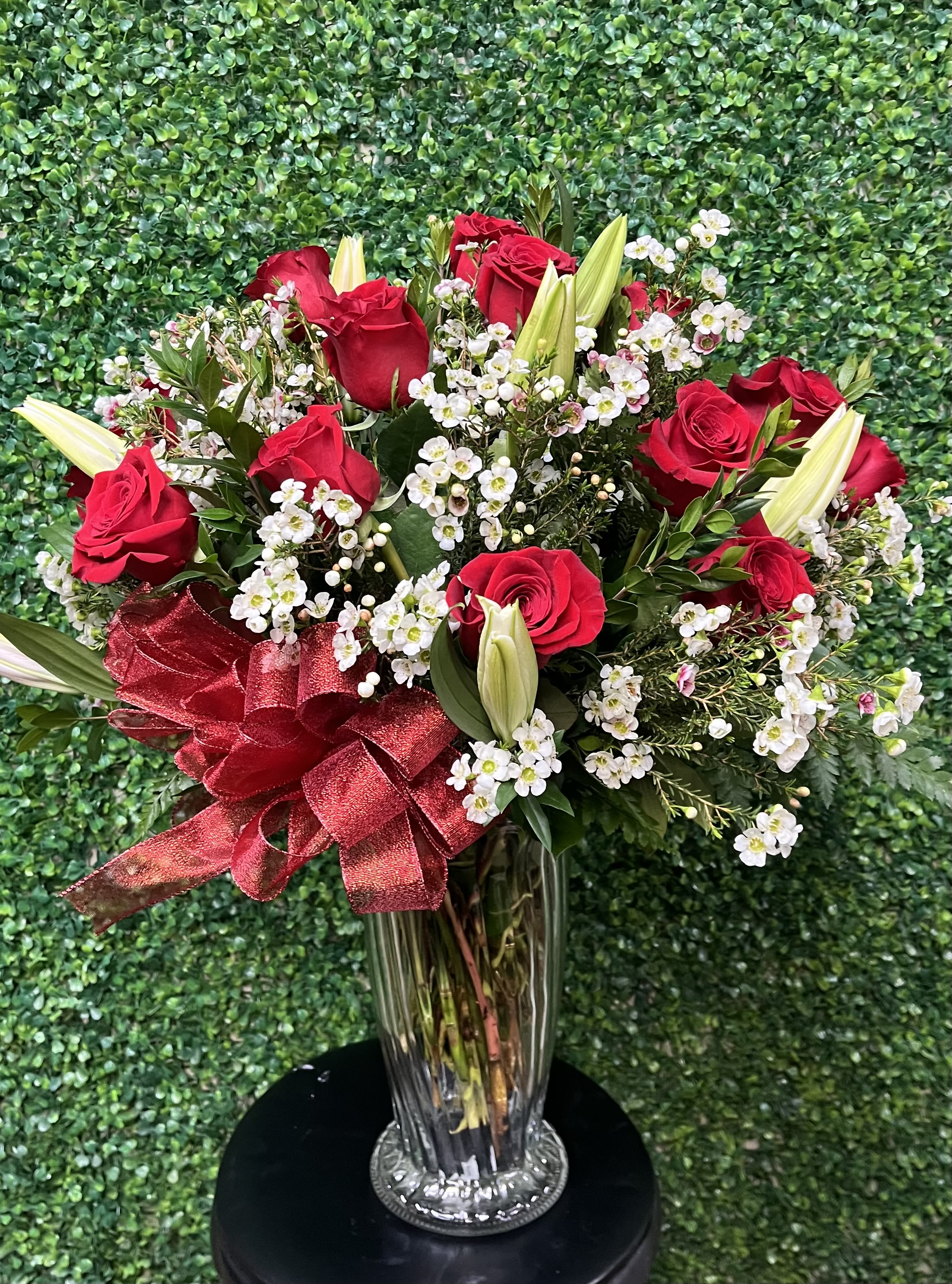 Roses and Lillies - Send out a dozen of premium roses with lilies. This large arrangement will definitely put a smile on someone’s face. Some Lilie’s may be bloomed and some may be closed. Depending upon availability, Lilie’s usually come in pink and white. 