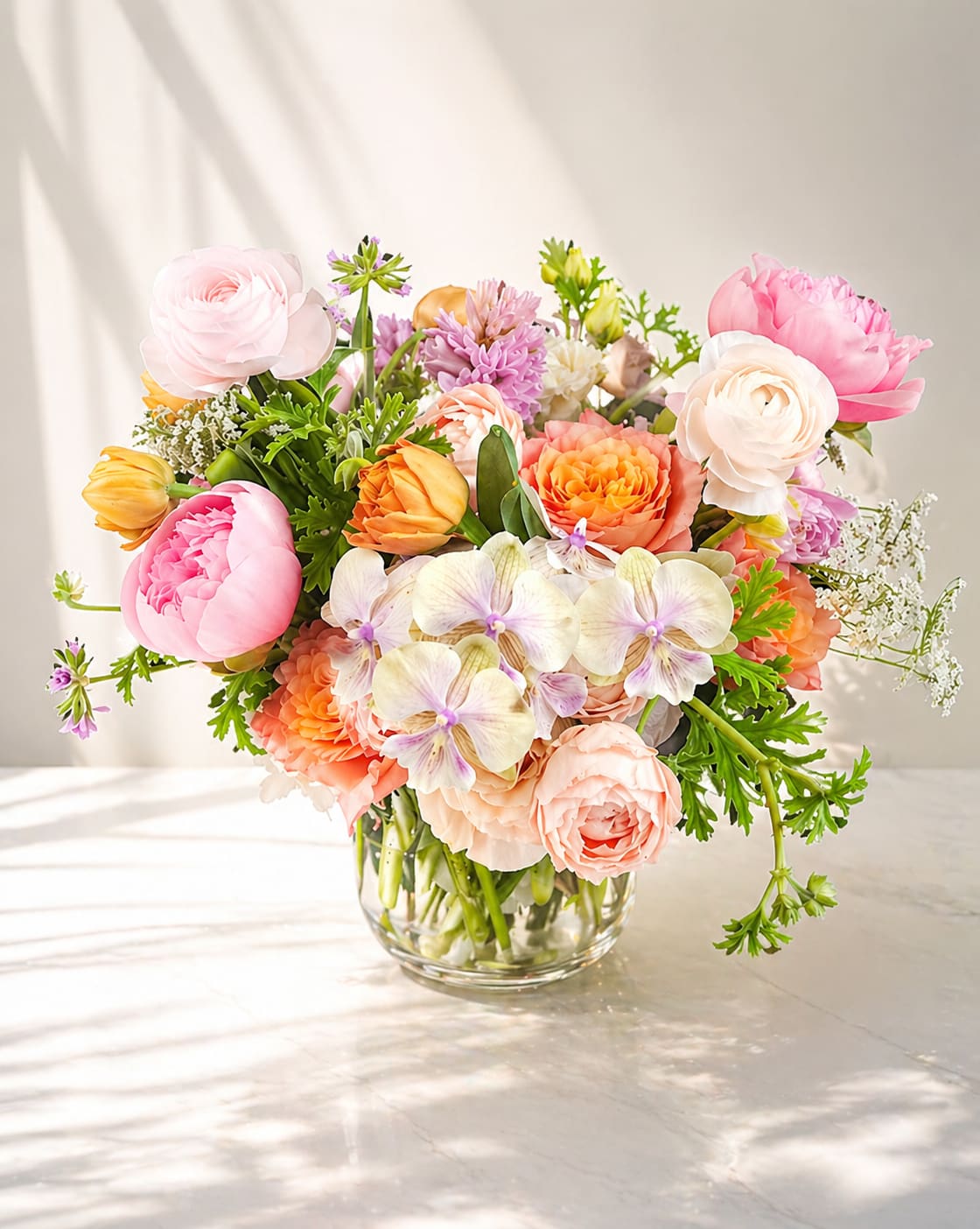 The Matriarch - A lavish expression of love and gratitude, The Matriarch features an artful blend of premium seasonal blooms in soft peach, coral, and blush.  The arrangement is a timeless tribute to the mom who deserves everything beautiful.  Perfect for Mother's Day!  