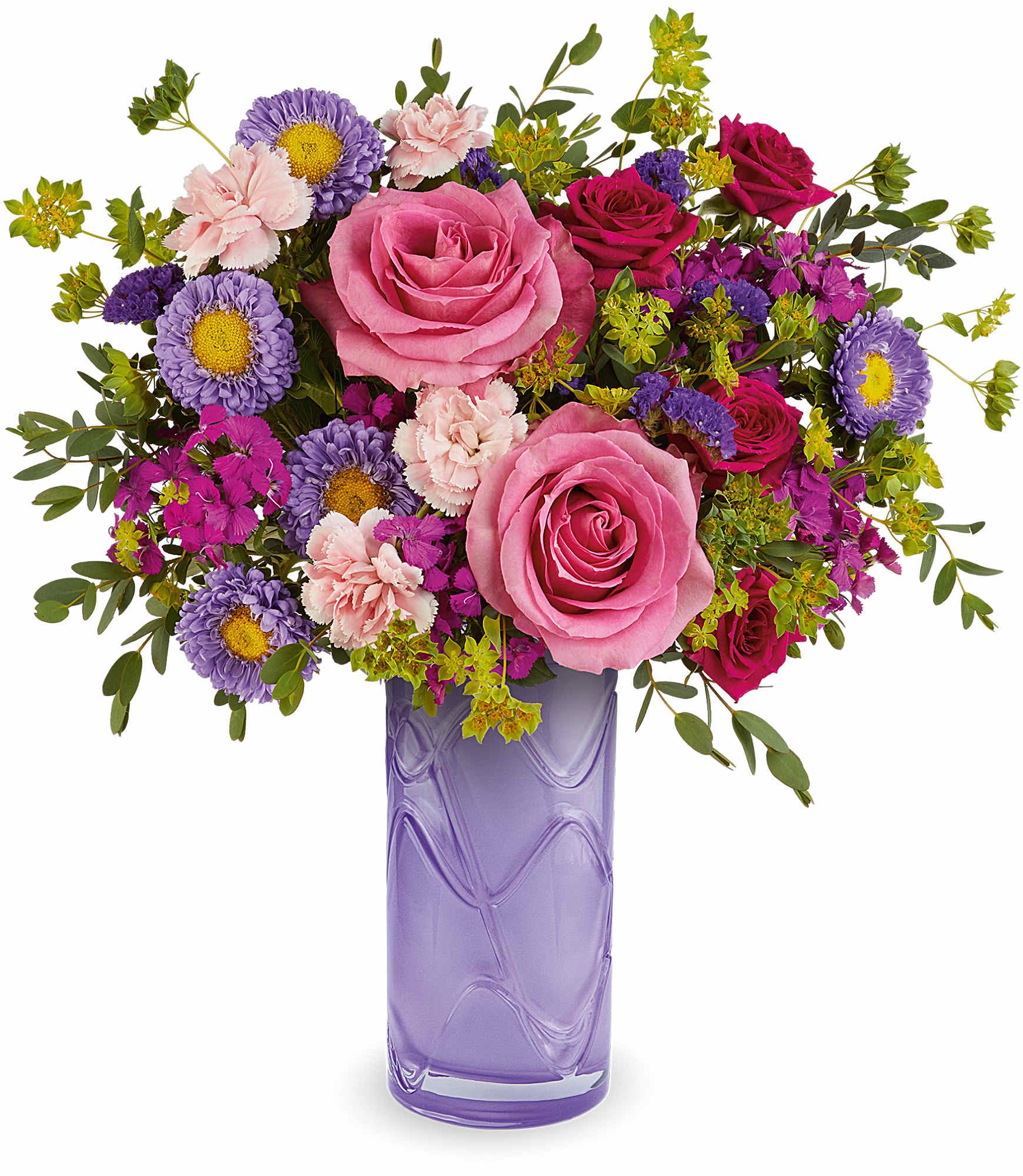 Painted Petals Bouquet - Brighten her Mother's Day with our Painted Petals Bouquet, a vibrant mix of pink and purple blooms artfully arranged in our Pretty Daydream Vase. This cheerful gift brings color, charm, and lasting beauty to her day.