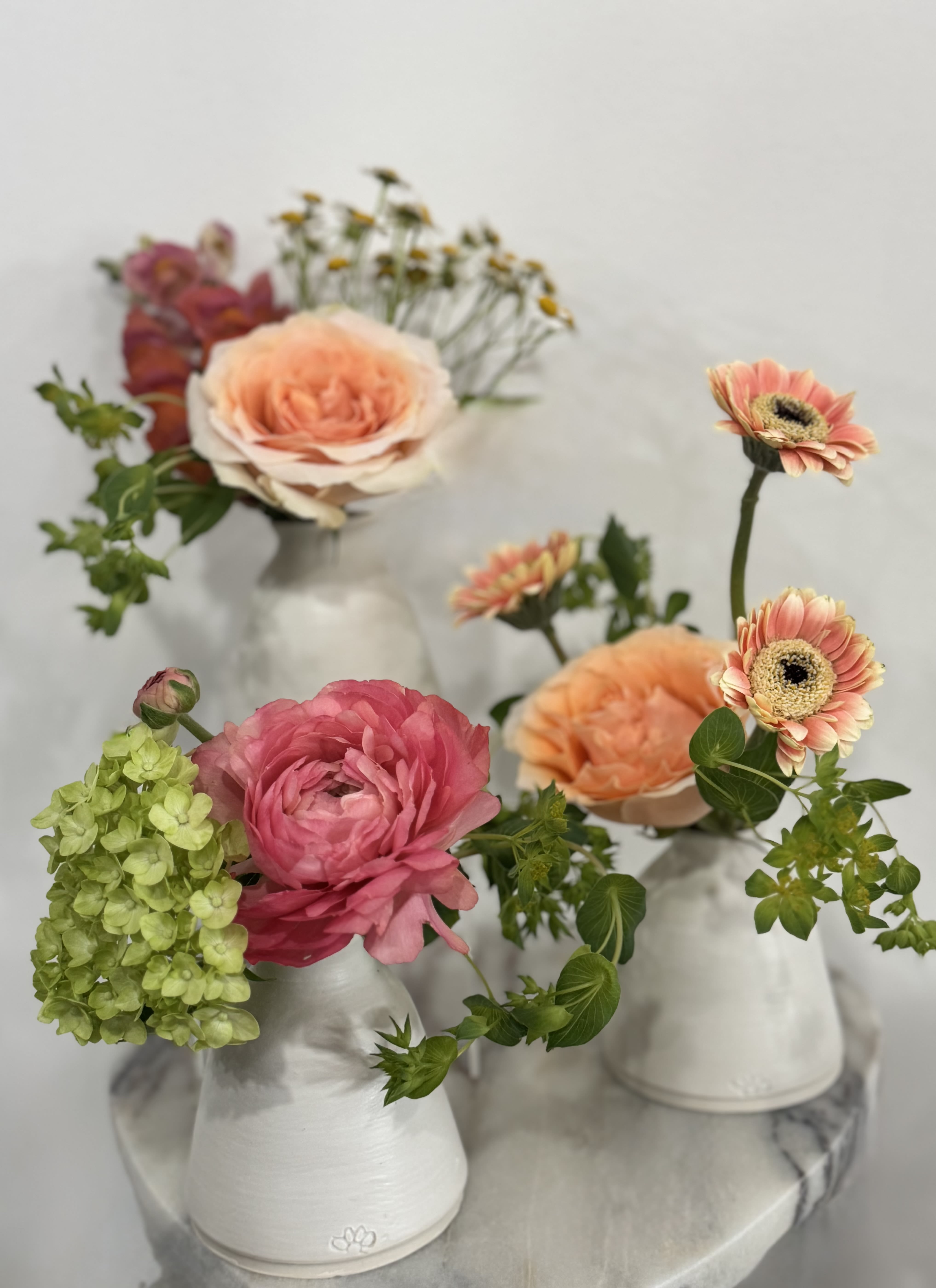 San Francisco made Ceramic Bud Vase Trio  - Give the gift of a one of kind , small batch ceramic vases from local artist Shannon Marie Ceramics. The white bud vases are exclusively sold at FLEURT. Filled with blooms and delivered ready to dress up a chic table. A true San Francisco Keepsake. 