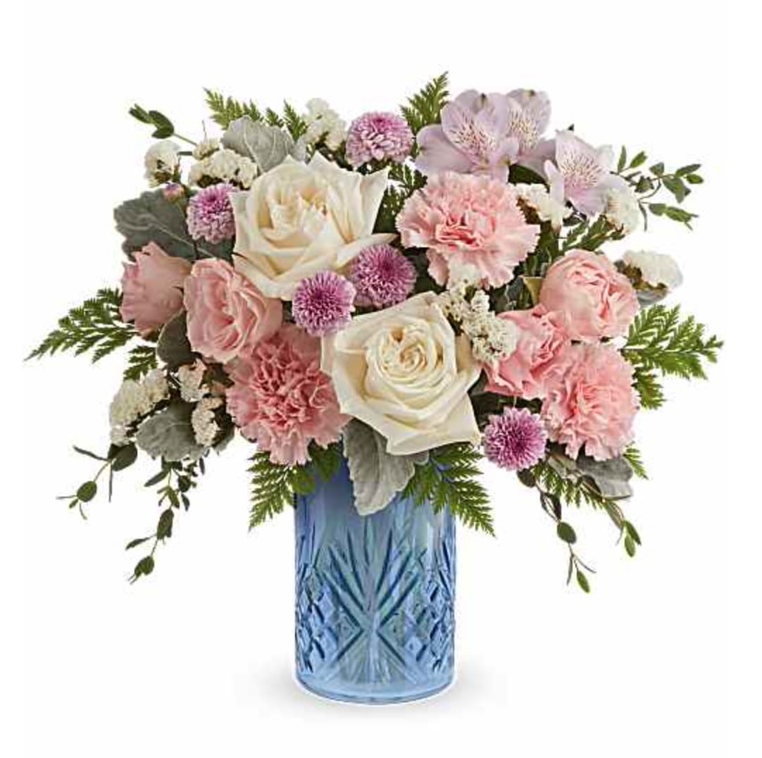 Blue Belle Bouquet - Our Blue Belle Bouquet is a sweet Mother's Day flower arrangement of soft pink, white, and lavender blooms, beautifully presented in our Blue Belle Vase keepsake-perfect for celebrating Mom with fresh spring charm. Our Blue Belle Bouquet features white roses, pink spray roses, lavender alstroemeria, pink carnations, lavender button spray chrysanthemums, and white sinuata statice, accented with dusty miller, parvifolia eucalyptus, and Cleopatra leatherleaf fern, in our Blue Belle Vase. Orientation: All-Around
