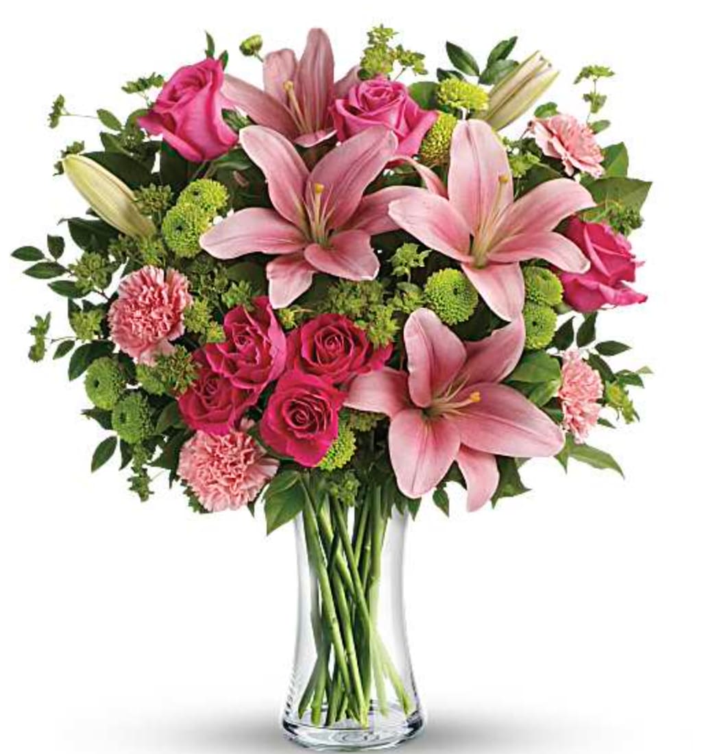 Dressed To Impress Bouquet - What's better than pink? More pink! This blissful bouquet of roses and lilies is arranged and delivered by a local florist in a classic glass vase. This flower arrangement is sure to put some pink in their cheeks and a smile on their faces! Orientation: One-Sided  SUBSTITUTION POLICY – Always deliver the freshest flowers! Please note the bouquet pictured reflects our original design.  If the exact flowers or container in this arrangement are not available, our local florists will create a beautiful bouquet with the freshest available flowers.