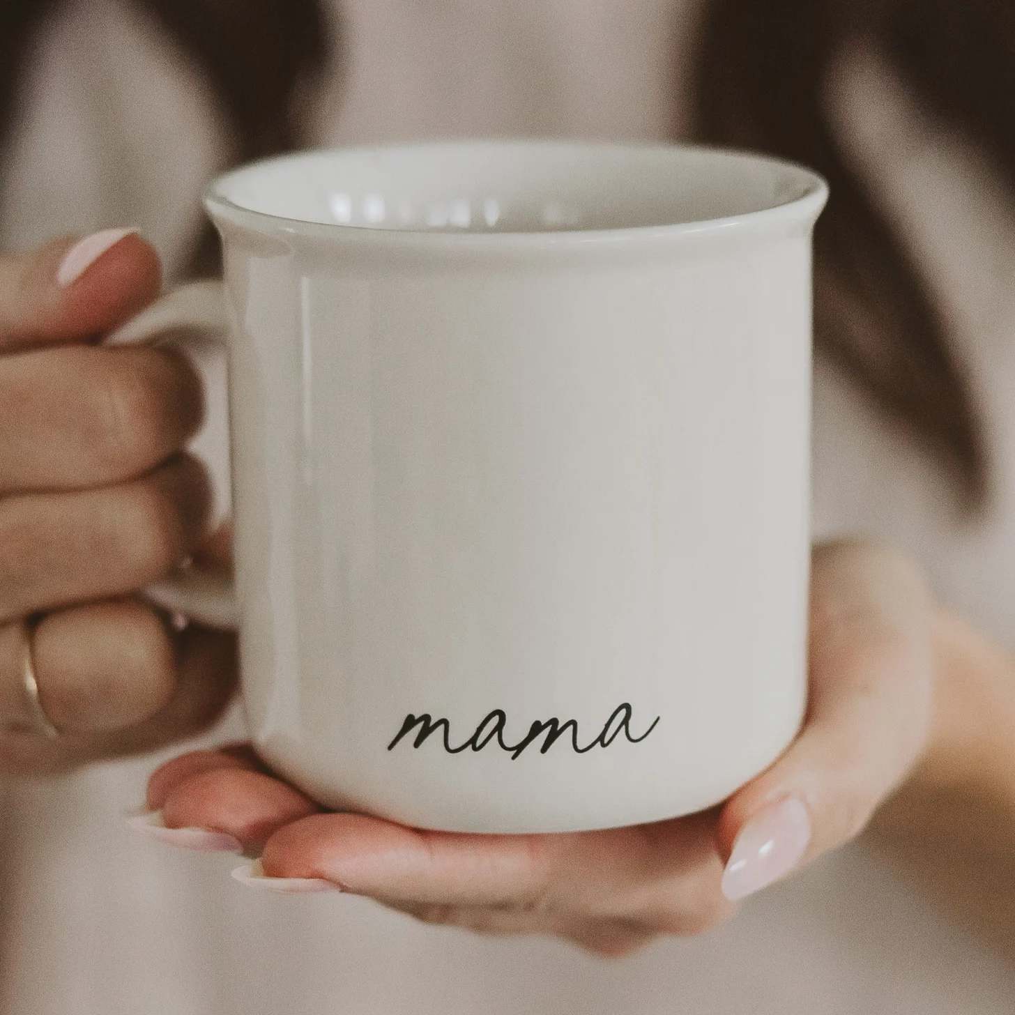 Mama 11 oz Campfire Coffee Mug - Our Mama coffee mug is the perfect gift for Mother's Day, new moms, baby showers, and more. Its simple design is something she will love year-round.  DETAILS:  • 11 oz Capacity • Campfire Style Mug • Cream neutral color with black script "mama" design on both sides   • Size: 3.75"W x 3.63"H (4.88" w/handle)